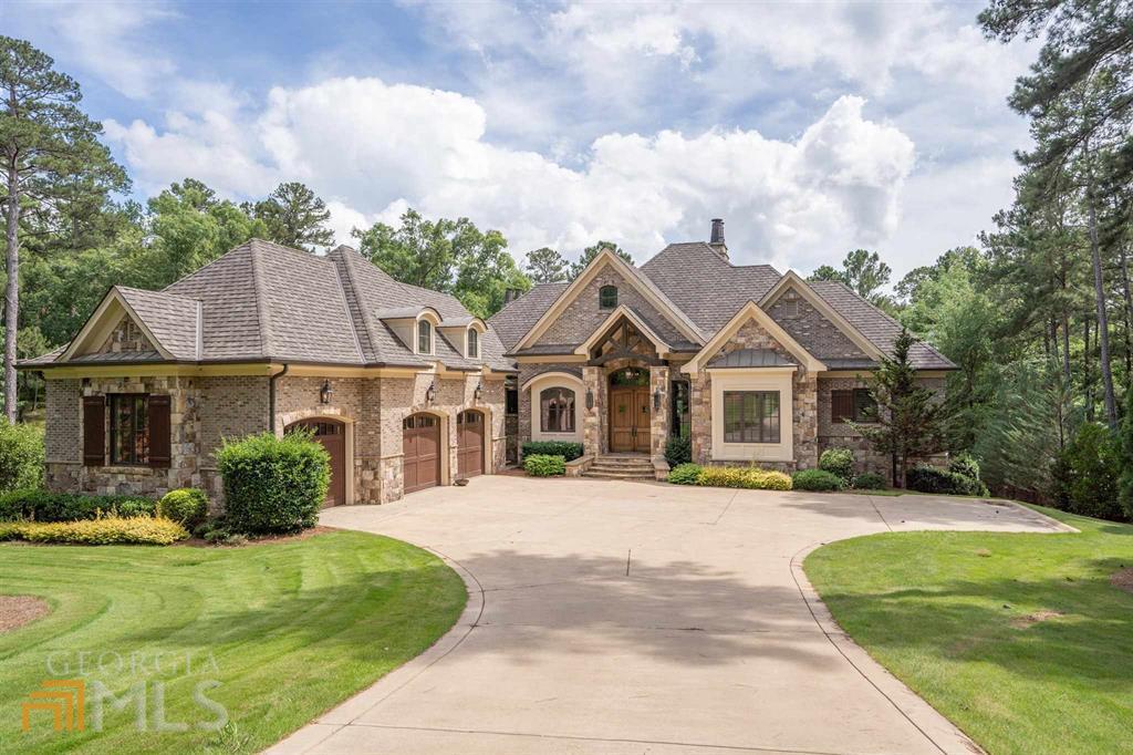 HIS 6 BEDROOM, 6 FULL AND 2 HALF BATH HOME IS LOCATED ON A QUIET CUL-DE-SAC. IT SITS ON A BEAUTIFUL PRIVATE WOODED LOT WITH GREAT YEAR AROUND LAKE VIEWS. THISHOME FEATURES A FLOWING FLOOR PLAN WITH WINDOWS, PORCHES AND PATIOS. THE RESORT STYLED POOL IS PERFECT FOR ENTERTAINING FAMILY AND FRIENDS. GOLF MEMBERSHIPIS AVAILABLE.