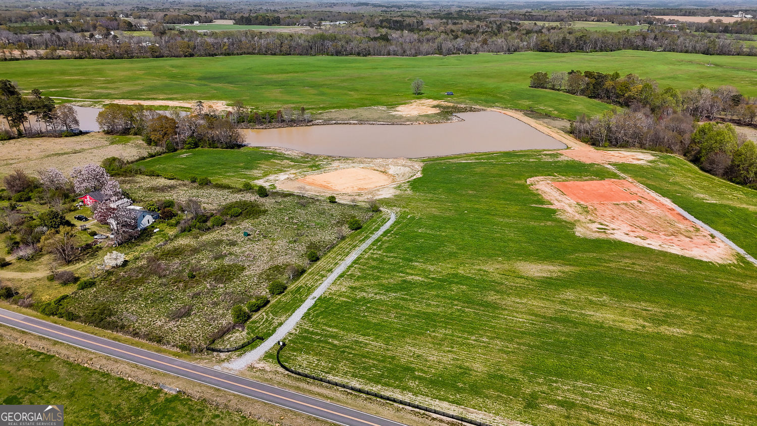 Lot 6 - The Farms at Redbone. Gorgeous 8.5 +/- acre lot with pond frontage in Lamar County's beautiful "Redbone" area. This tract is part of The Farms at Redbone, an exclusive development of raw acreage parcels with ponds/water frontage and gorgeous homes priced in the 600's and on acreage! This is not a subdivision - these are beautiful road frontage lots with no HOA. Build your dream home here, overlooking the pond. There's a homesite already graded and padded on the lot. The homesite sits off the road and is privately tucked away. There's a gravel drive access in place already and the front of the property has new black four board farm fencing up. The lot is level and open in a pasture like setting. Bring your friends and family and live side by side - the neighboring lot, Lot 6, is also for sale and shares the pond frontage! Purchase this lot with a loan through AG South with as little as 15% down or call your local bank for a land loan. The gorgeous lots won't last long!