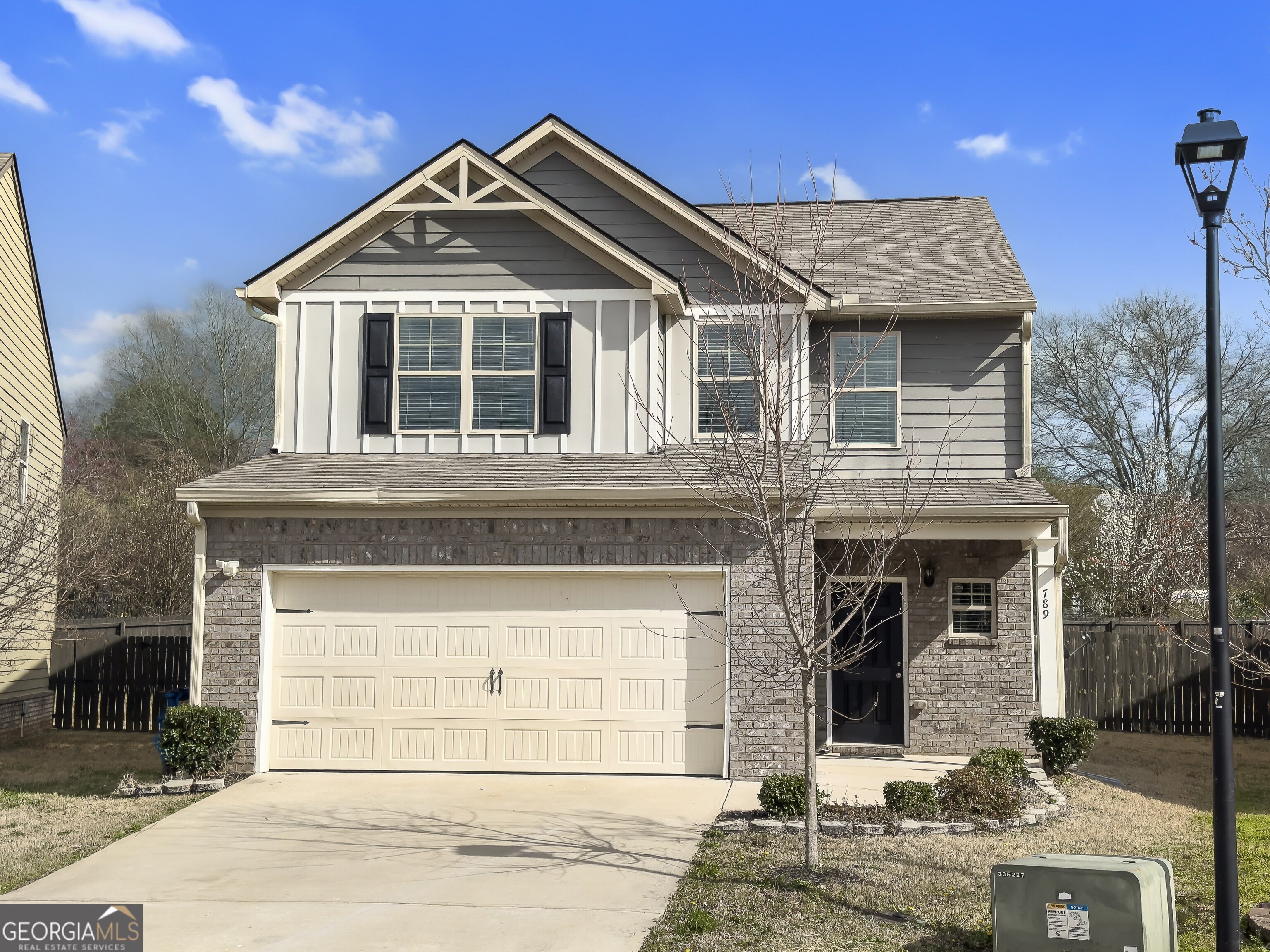 PRICE IMPROVEMENT! Don't miss this beautifully updated 4-bedroom, 2.5-bath craftsman-style home, perfectly tucked away in a quiet cul-de-sac and boasting one of the largest fenced-in backyards in the neighborhood! Built in 2019, this move-in ready home shines with fresh interior paint throughout (yes, even the garage!), brand-new LVP flooring on the main level, and freshly cleaned carpets. The open-concept kitchen is truly the heart of the home, featuring abundant cabinetry, a large center island, and plenty of space for entertaining. Upstairs, the oversized owner's suite impresses with a massive walk-in closet, while three generously sized secondary bedrooms share a full bath. Step outside to your private backyard oasis, complete with a patio that's ideal for relaxing evenings or weekend gatherings. Conveniently located just minutes from shopping, dining, medical facilities, and I-75, this home offers the perfect balance of comfort, convenience, and peaceful cul-de-sac living. Schedule your showing today and take advantage of this fantastic price improvement!