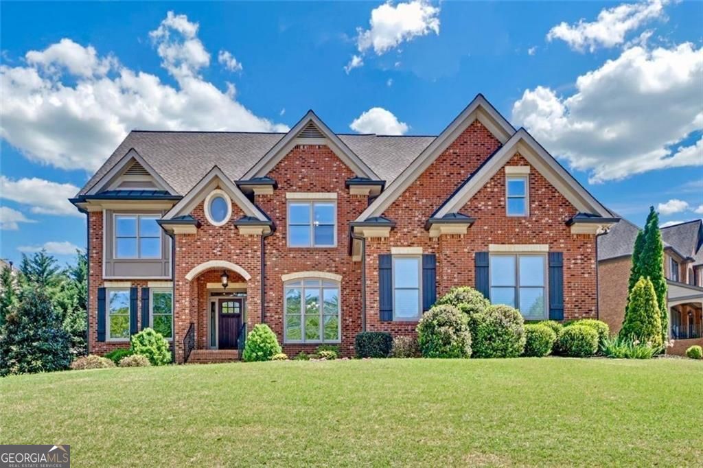 Welcome to 866 Coopers Ridge Path-an exceptional six-bedroom, five-bath residence nestled in the coveted Heritage at Grayson community. This four-side brick masterpiece harmonizes timeless elegance with thoughtful design, offering over 6,000 square feet of meticulously crafted living space. Step inside to discover a luminous, open floor plan adorned with custom carpentry, soaring tray ceilings, resurfaced hardwood floors, and an abundance of natural light. At the heart of the home, a chef-caliber kitchen awaits-equipped with a five-burner cooktop with easy-clean coating, double ovens, sleek stainless-steel appliances, and a custom quartz island built for both function and beauty. The adjacent formal dining room provides a refined setting for unforgettable gatherings. Every detail has been curated for luxury and ease-from new plumbing fixtures and low-energy lighting to premium carpeting throughout. The expansive Owner's Suite offers a serene retreat, complete with a spa-inspired bath and oversized his-and-hers closets designed for effortless organization. Engineered for both comfort and efficiency, the home features dual brand-new HVAC systems, two 40-gallon water heaters replaced in May 2025, and a 50-year architectural roof with a transferable warranty. The oversized three-car garage includes custom cabinetry, a deep utility sink, and dedicated 20A and 240V outlets for all your needs. The fully finished terrace level adds incredible versatility, featuring a designer kitchenette, a media room with illuminated tray ceilings and a stone alcove, a built-in library, art or workstations, and a private guest suite with a solid wood sliding door. Additional enhancements include a custom full bath with cast shower, a reinforced storm shelter, spray foam insulation, and a dedicated HVAC system for the lower level. Outdoor living is nothing short of extraordinary-enjoy two cedar decks, one with a built-in fireplace and pizza oven, offer the perfect backdrop for entertaining or relaxing. Enjoy ambient deck lighting, under-deck and fireplace storage, paver walkways, a full irrigation system, and lush, curated landscaping that frames the property in natural beauty. Meticulously maintained by its original owners and located within a vibrant swim and tennis community in a top-rated school district, 866 Coopers Ridge Path is more than a residence-it's a lifestyle. Welcome home to extraordinary comfort, craftsmanship, and timeless luxury.