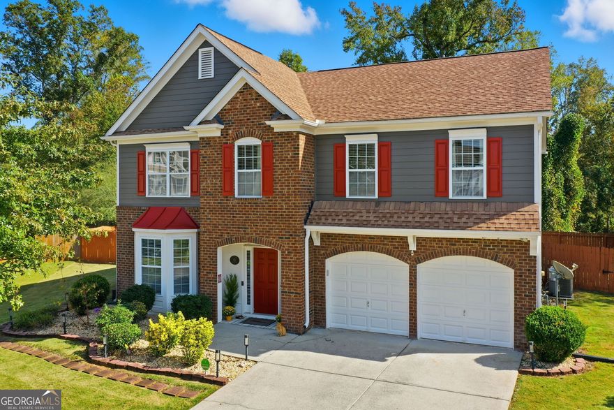 Tucked in a peaceful cul-de-sac with jaw-dropping curb appeal, this home will capture your heart before you even step inside! Located in sought-after Forsyth County, this beautiful home features a newer architectural-shingle roof, two new HVAC and furnace systems, and over $30k invested in luxury bathroom renovations. Built on a slab foundation, offering a long-term structural stability and low maintenance. As you enter, you're greeted by a bright two-story foyer. To your left is a versatile room currently used as a bar and entertaining space, which can easily be converted back into a cozy sitting area if preferred. A large, separate dining room provides plenty of space for family gatherings and holiday dinners. The kitchen opens directly to the family room and includes a breakfast area, newer microwave and dishwasher, and generous counter space. From the kitchen, step out to the patio with a pergola perfect for outdoor entertaining or relaxing evenings. The fully fenced, flat backyard offers privacy and room to play. The two-car garage provides direct and convenient access to the kitchen, making unloading groceries a breeze. Upstairs, the oversized primary suite includes a sitting area, walk-in closet, and a fully renovated bath with double vanities, a soaking tub, and a separate shower. Three additional bedrooms plus a versatile loft/media room, laundry with newer washer and dryer, and another fully updated bathroom complete the upper level. Forsyth County continues to experience remarkable growth and development, making it one of the most desirable areas. With top-rated schools, expanding retail and dining options, nearby parks, and ongoing community improvements, this area offers the perfect blend of convenience, lifestyle, and long-term value. The neighborhood also features a pool, playground, tennis courts, perfect for staying active close to home. This home has been freshly painted on the exterior (2023), includes a termite bond, and has been lovingly maintained - ready for you to come see in person and move into your new home just in time for the holidays!