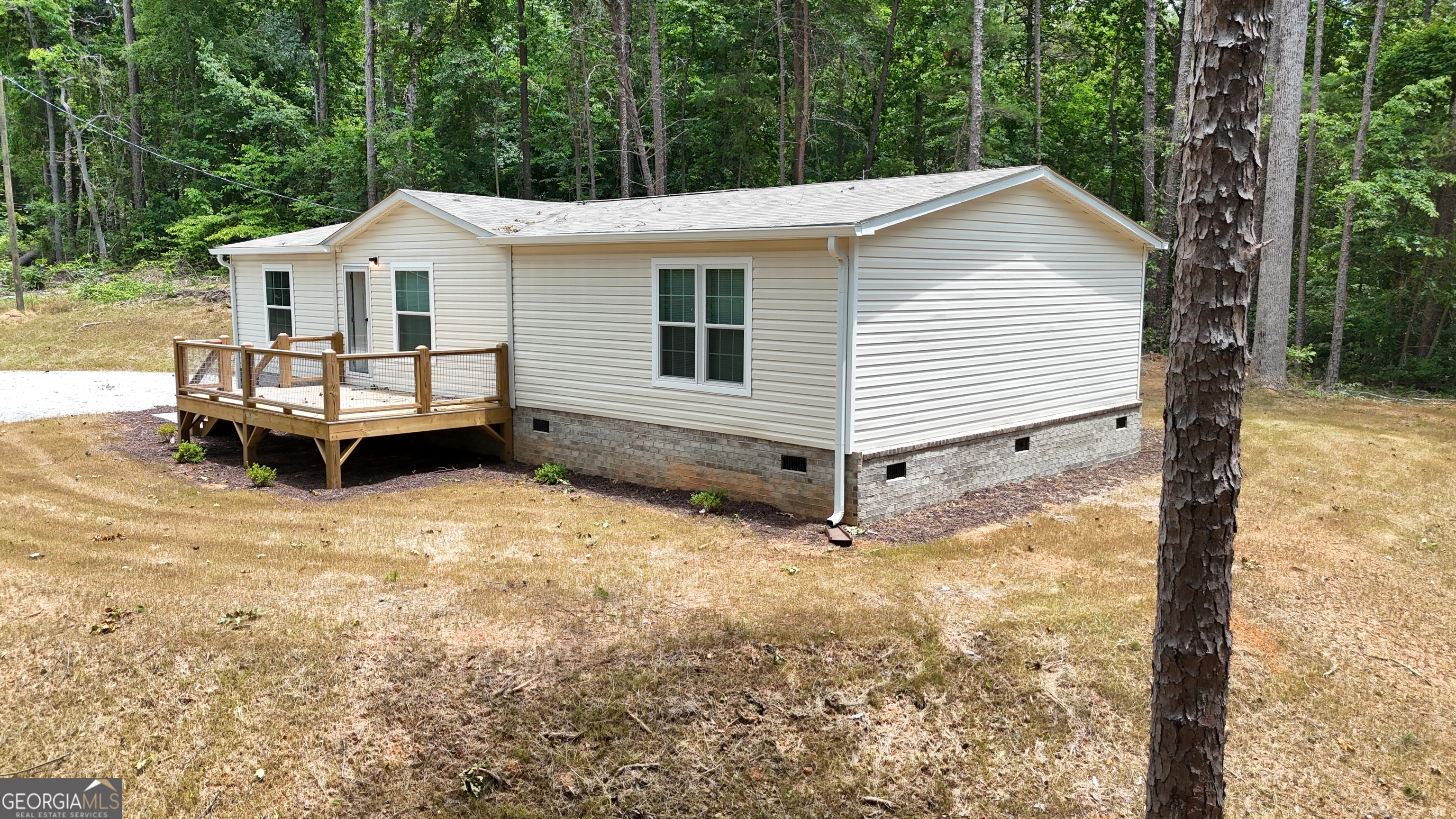 Must see! Brand new manufactured home in Lake Harbor Shores, a Lake Hartwell community. This home is USDA, VA, FHA and Conventional lendable. All appliances are included in the sale of this home. It also comes with a one year warranty. Come see this perfectly located, 3 bed and 2 bath home that has so much to offer. The Lake Harbor Shores subdivision has optional access to its own community lake area; with a boat dock and ramp, along with play area and pavilion. This home has 2 sizable decks on the front and rear of home. A large master bedroom and bath on one end gives privacy, while boasting an open concept kitchen, dining, and living room with electric fireplace. The 2nd and 3rd bedrooms have generous closets in both. Ceiling fans are included for each bedroom, as well as the living room. Bring your boat and enjoy lake living.
