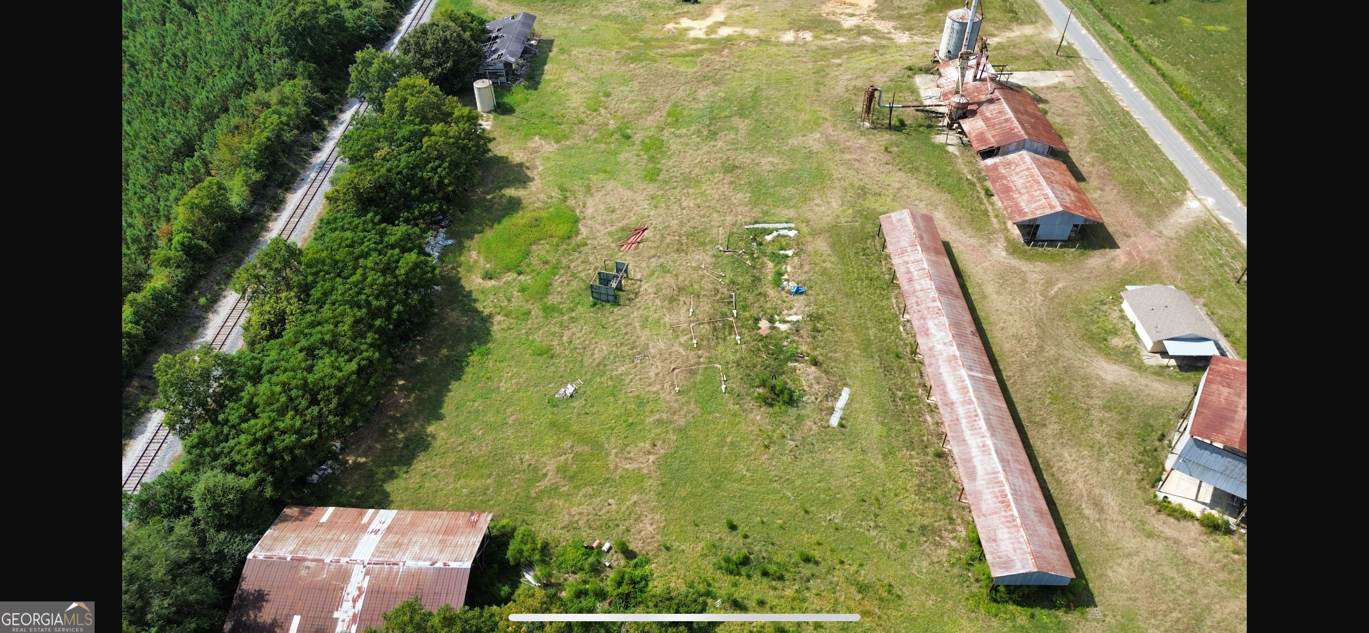 Commercial property in Dudley Ga. This 5.12 acres has 4 pole barns perfect for storage, as well as a 798 sqft office building. The property also features city water hookups.