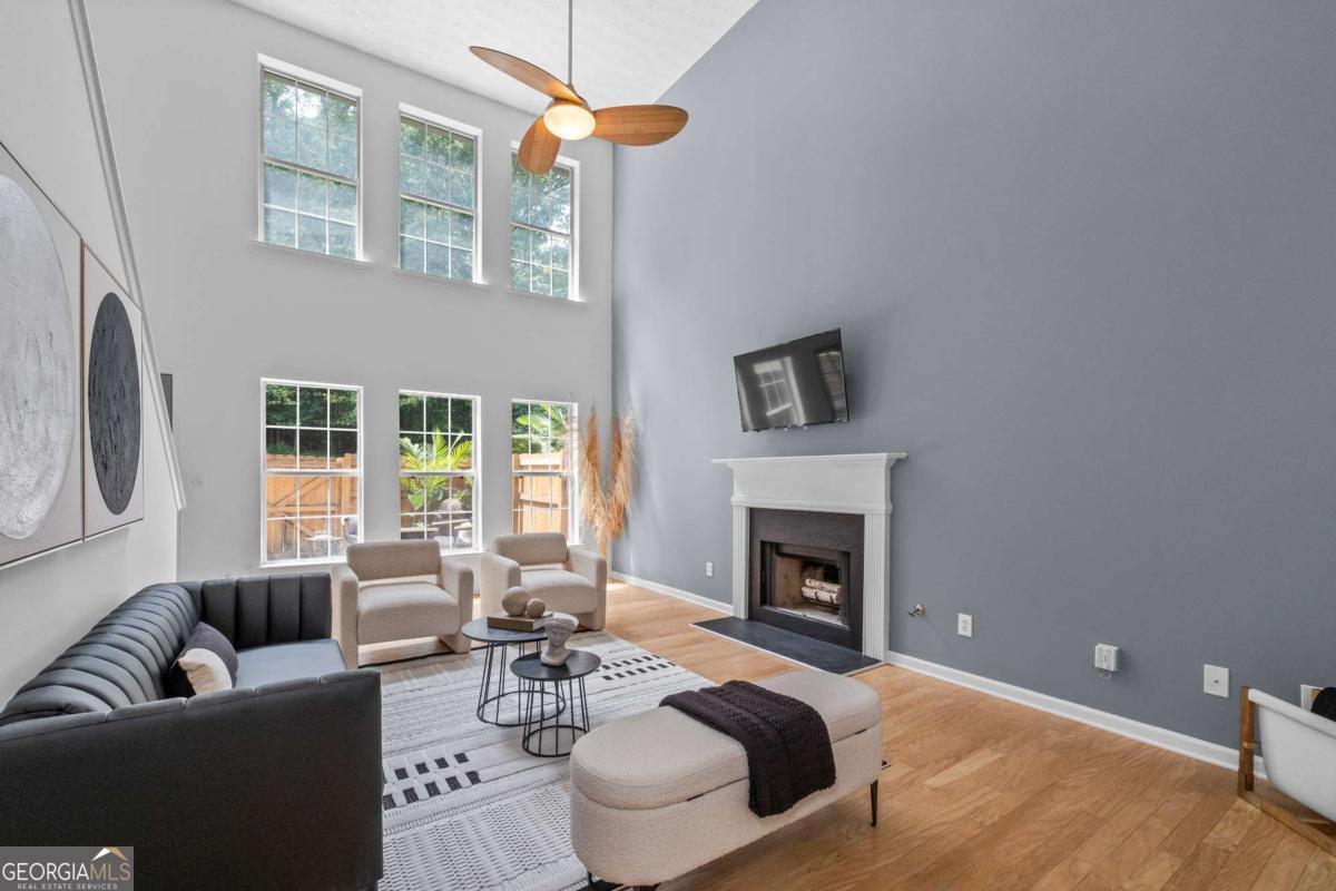 Spacious 3 bedroom and 3 full bathroom townhome in a tree-lined, gated community. These townhomes do not have shared walls but instead are attached in the rear by their storage units. Only 3 miles from East Atlanta Village shops and restaurants, this home is also, less than 2.5 miles from the new Halidom Food Hall, with its 10 food stalls and full cocktail bar. With it's central location, it's only minutes from I-20, downtown and midtown Atlanta. The home features a 2-story living room with 20-foot ceilings, a wood-burning fireplace and newly refinished hardwood floors. The gorgeous eat-in kitchen has upgraded slate tile floors, new quartz kitchen countertops and new stainless steel appliances. Each of the 3 full bathrooms have been updated with new vanities and fixtures. Both the interior and exterior of the home have been freshly painted. In addition, the home has a new roof and gutters that are barely 3 years old. The 2nd floor boasts a large master suite with vaulted ceilings and a spacious master bathroom with a new dual vanity and a soaking tub. The laundry room is conveniently located on the 2nd floor with washer and dryer included. The home's outdoor space has been upgraded with a large, fenced-in concrete patio perfect for relaxing or entertaining. It also has a 1-car garage as well as two exterior storage units. The community is beautifully maintained by a Home Owners Association that provides professional landscaping of all common areas including the home's front yard, the community gazebo and community dog park. Nearby Amenities: -Halidom Food Hall (2.4 miles) -East Atlanta Village (3 miles) -Eastlake Publix - (3.4 miles) -Eastside Beltline Trail - (4 miles) -Madison Yards AMC Theatre (4.2 miles) -Glenwood Park Kroger - (4.2 miles) -Edgewood Retail District (Target, Lowe's, Kroger, Five Guys, BestBuy) - (4.3 miles) -Krog Street Market - (5 miles) -Ponce City Market - (6.4 miles)