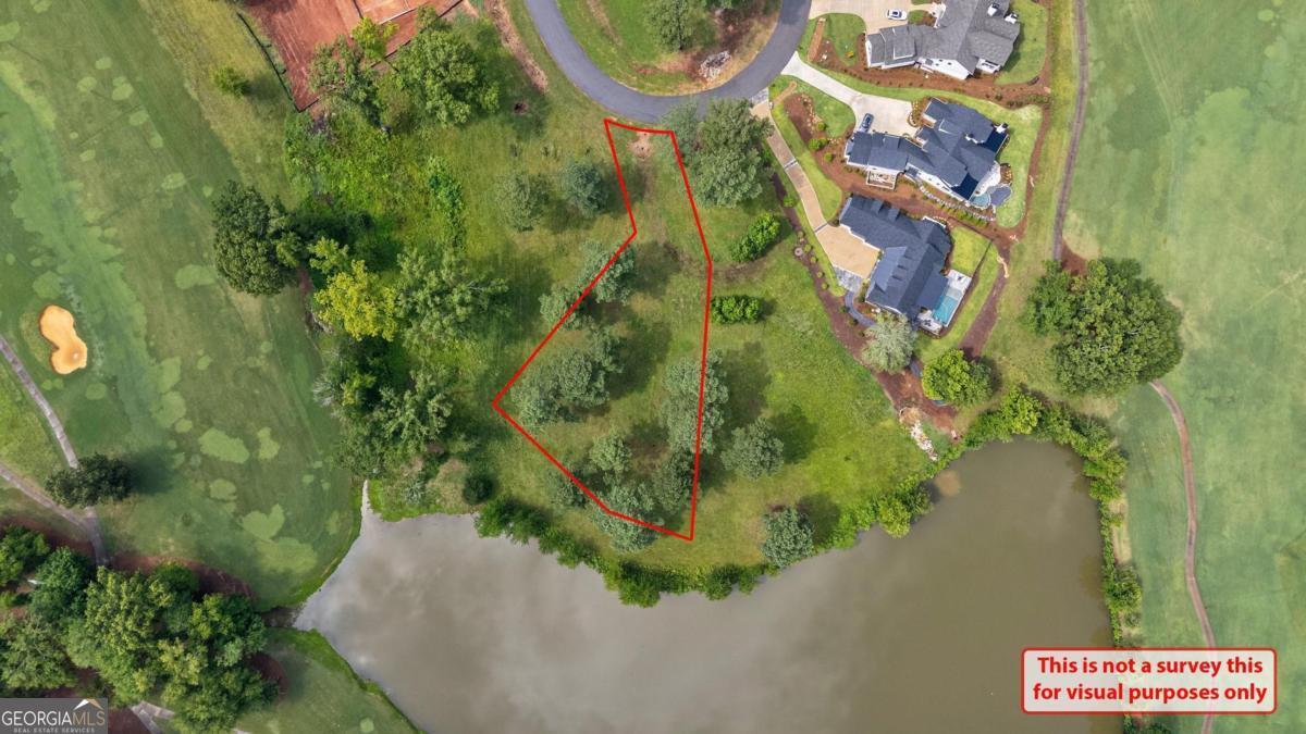 Don't miss this rare opportunity to own one of the best available lots in the prestigious Cuscowilla at Lake Oconee! This level 0.55-acre homesite is perfectly positioned to take full advantage of its scenic surroundings. Enjoy beautiful views overlooking the golf course and tranquil pond, with peek-a-boo vistas of Lake Oconee. Whether you're planning to build your dream home or invest in prime real estate, this lot offers the ideal blend of privacy, natural beauty, and premium amenities. Located within one of Lake Oconee's most sought-after golf communities, this property provides access to world-class golf, a private clubhouse, lakefront dining, pickle ball, tennis, and more-all just a short golf cart ride away. Build your legacy at Cuscowilla-where lake life meets luxury living.