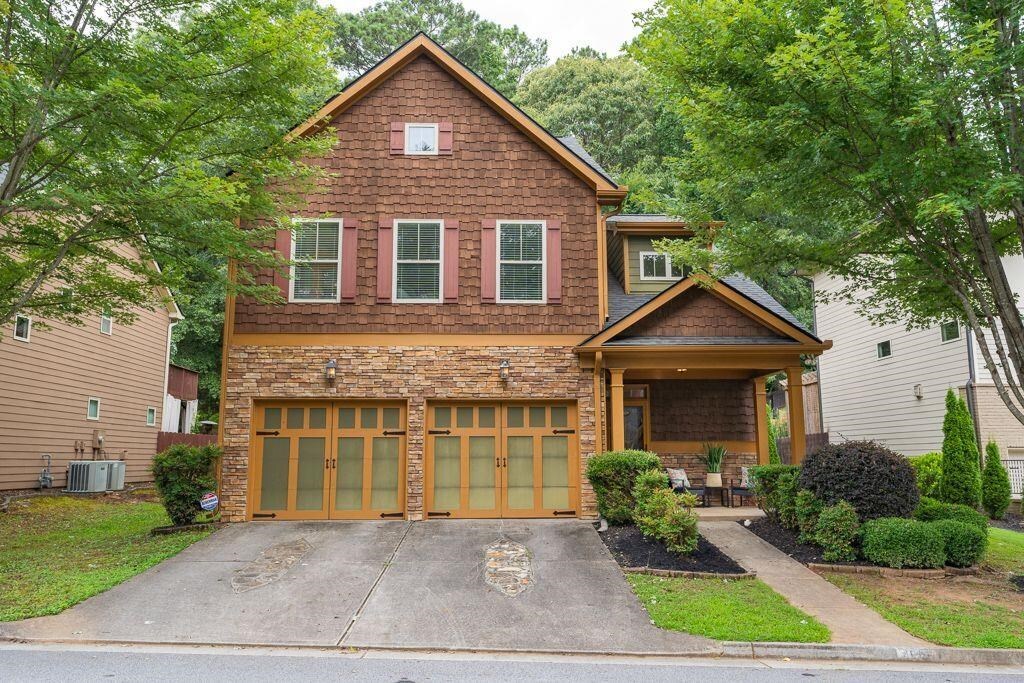 Absolutely stunning 3 bedroom/2.5 bathroom Pacific Northwest style Craftsman in the centrally located Eastside Walk community of East Atlanta. The bright two story foyer welcomes you into the warm and inviting home. The first floor boasts hardwoods floors, detailed millwork, gorgeous built ins and coffered ceilings. The fireside great room overlooks the enormous kitchen complete with oversized island & West Elm pendant lighting, custom cabinetry, granite counters, subway tiled backsplash, walk in pantry and top of the line Kitchen Aid appliances. Enjoy dinner or an evening glass of wine on the covered rear patio right off the dining area! Upstairs you won’t find a stitch a carpet…instead, newly installed luxury plank flooring flows throughout! At the top of the stairs, a fantastic flex space makes the perfect office, play room or just additional living space! The primary sweet is palatial and features a custom built out closet sure to please anyone as well as a private deck, the ideal spot for a morning cup of coffee! The secondary bedrooms are generously sized and share a convenient Jack n Jill style bath with plenty of additional storage. You won’t want to miss the walk in laundry room or the large 2 car garage, a HUGE plus for the city. Brand new roof just installed! Experience intown living without having to give up any of your must haves, this home truly has it all!