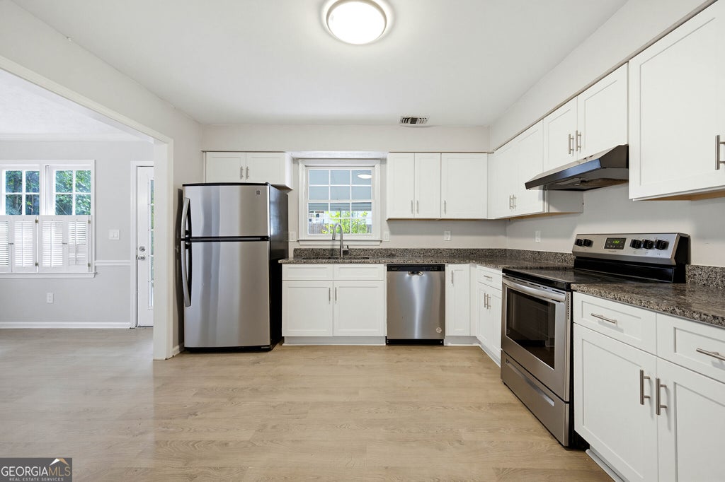 Photo of 1220 Grayland Hills Trail, Lawrenceville, GA 30046 (MLS # 10875189)