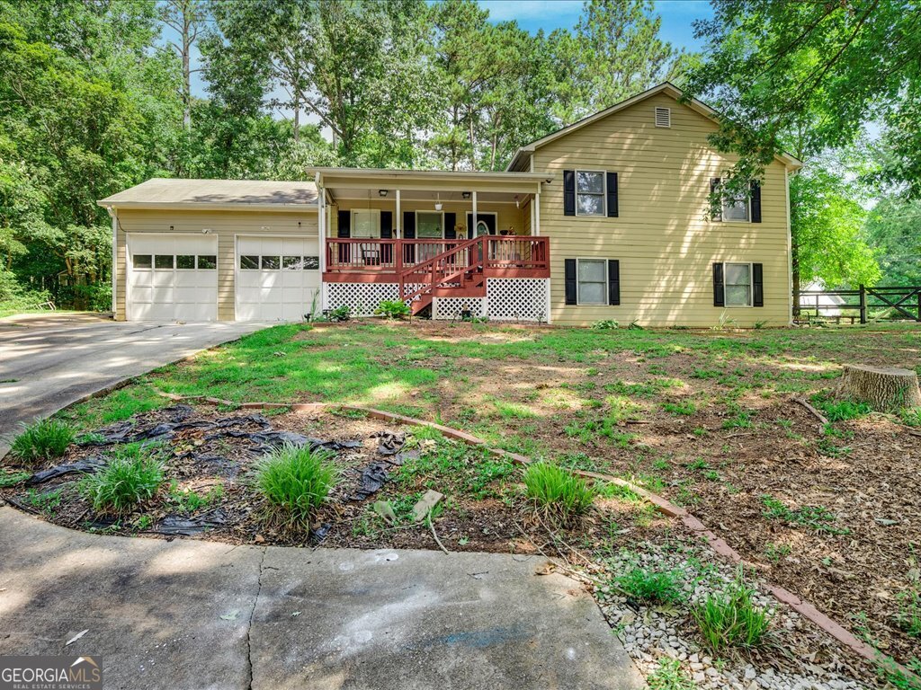 Stunning 4-bedroom, 2.5-bath home in Auburn's sought-after River Glen neighborhood, offering 2,200 sq ft of living space across three levels with hardwood floors, vaulted ceilings, and a finished basement featuring a fireplace and exterior access-perfect for guests or a home office. Situated on a serene 0.59-acre lot with a private backyard, this property includes a 2-car garage and central HVAC, blending comfort and functionality. Its prime location provides effortless access to I-85 and Highway 316, ensuring a quick commute to Atlanta (~45 mins) and nearby commercial hubs like The Avenue Braselton and Chateau Elan. Families will love the top-rated schools, including Auburn Elementary (GreatSchools 7/10), Westside Middle (6/10), and Apalachee High (7/10), known for strong academics and athletics. With no HOA fees and low property taxes, this home is a rare find for commuters, growing families, or investors-don't miss this opportunity to own in a thriving community!
