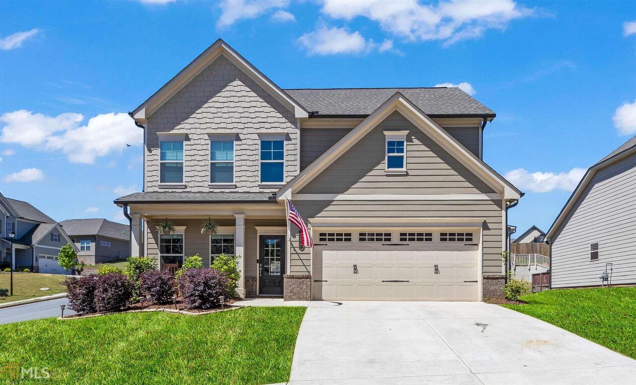 *Showing Begins May 7* Amazing 2018 - Better Than New 2 Story Home in Desired Mundy Mill Subdivision. Open floor-plan with Luxury Finishes! Hardwood floors in Foyer, Kitchen, and Breakfast Room overlooking the Living Room. Comfy Upgraded Carpet in Bedrooms and Family Room. Kitchen iIsland with Granite, Stainless Steel Appliances, Recessed Lighting and Large ISLAND. Powder Room on Main can be used as Home Office. Master Suite boasts a Private Bath with Double Vanity, Frameless Glass Shower Door. LARGE walk-in closet. Laundry Room Upstairs.Outdoor Flat Backyard is newly fenced with lots of Privacy in this Corner Lot. Covered Rear Patio offers great outdoor space to customize and enjoy. 10 Out of 10. You Do Not Want to Miss This!