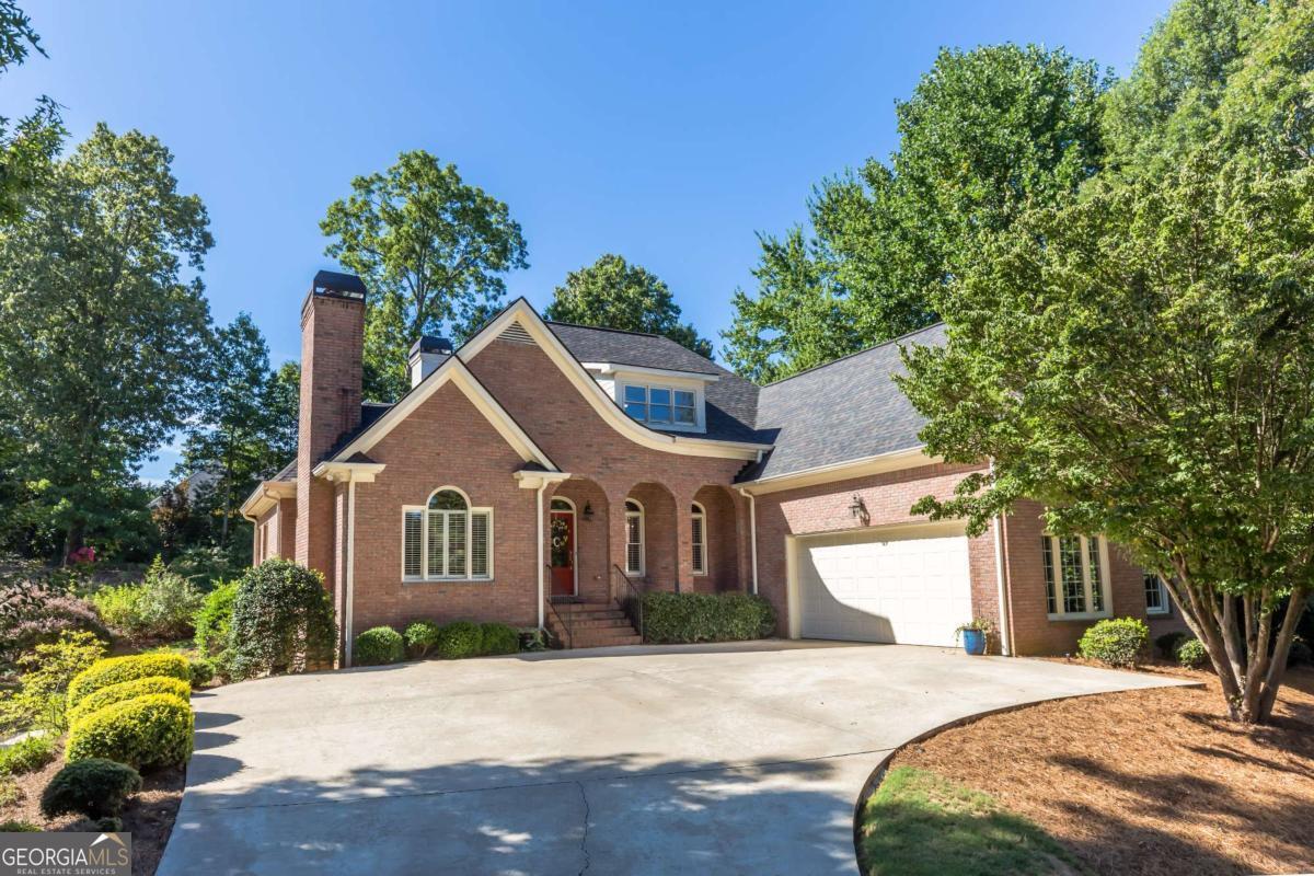 Come see this Warm and Inviting 4-side brick Luxury Home in the beautiful parklike atmosphere of the Kenwood section of the Royal Lakes Golf Community. Just a few of the Wonderful features of this well maintained 4B/3.5B includes a spacious family/keeping room with Gas logged fireplace built in bookcases and bay window. White kitchen with solid surface counters, decorative tile back-plash and Walk-in pantry overlooks the family room with breakfast bar and breakfast area that leads out to covered patio. A spacious foyer entry is open to the Elegant Dining room that is perfect for special family occasions or any kind of entertaining and has Exquisite crown molding and finishing touches. You'll love to snuggle up in the cozy sitting room with fireplace just perfect for quiet chats or reading. A special feature of the Home are (Two!) Bedroom Suites on the Main (which of course includes the Primary) with an additional room for the all important Home Office! Master Suite has gorgeous trey ceiling in both Bedroom and the deluxe Bath plus a separate entrance to the Dramatic Vaulted Covered Patio for your quiet mornings in the private backyard. On the 2nd floor level there is a spacious loft game or play area with 2 more large bedrooms that share a Jack and Jill bath. All rooms have spacious walk in closets- you will never run out of storage! Additionally, notice the separate drive to the boat door and entrance to Full unfinished Basement with incredibly high ceilings, floor drain and 1/2 bath. Basement has worked well as a shop but bring your own ideas! This basement has a huge open spanned room that gives you many possibilities to design as you see fit. Gleaming Hardwood Floors, Exquisite Trim work of the Fit & Finish and well designed living space gives you all you need to enjoy living in this beautiful walk friendly neighborhood and golf community. Here you will find a championship golf course, clubhouse, tennis courts, pickleball, resort-style pool with waterslide and splash pad, scenic lakes, and activities for all. Perfect location near shopping and 985 corridor. Please use Showing time to schedule