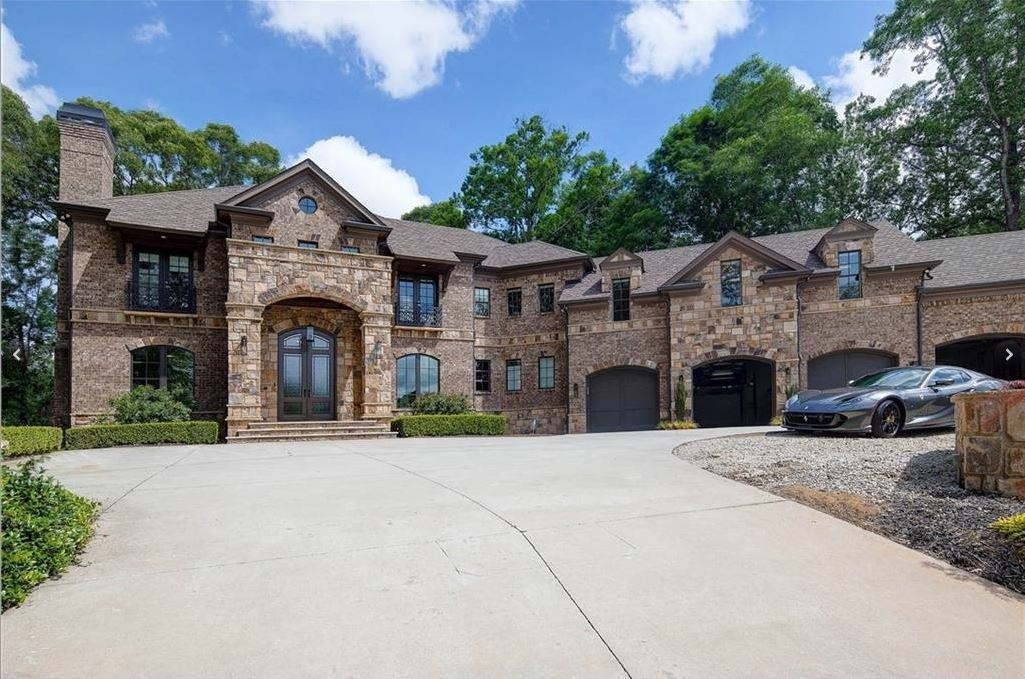 Gated estate on corner lot in N. Buckhead is a stunning departure from ordinary. Soaring two-story foyer with w/silver leaf dome & dramatic staircase make a memorable statement. Dining Room w/enchanting Venetian plaster walls. Casual opulence in kitchen & keeping room overlooking resort-like cabana, pool, sport court. One-of-a-kind master closet is glamorous & functional w/room for 300+shoes. Plenty of room for entertaining in guest home & sleek finished basement. Shiny surfaces, muted colors, & sensual fixtures were carefully selected to maintain drama & warmth. Make an offer!