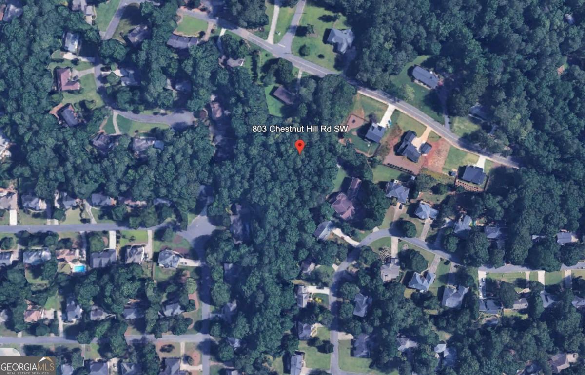 Prime Development Opportunity or Dream Home Site in Marietta Located in one of Marietta's most sought-after areas, this 1.82-acre parcel presents a rare opportunity for investors and homeowners alike. Just 2.5 miles from downtown Marietta, this property offers easy access to shopping, dining, festivals, and entertainment while maintaining a sense of privacy and tranquility. For developers, this land was originally approved in 2019 for four single-family homes. The approved plat and civil plans are available for review. These plans are for reference only. The city would need to reapprove any future development plans. Alternatively, for those seeking to build a custom dream home, this expansive lot offers the perfect canvas. Surrounded by newly constructed luxury homes, the property provides a prime location for a private estate. The land is currently wooded, with a relatively flat front and a gentle slope in the back, making it ideal for a walk-out basement and a beautifully landscaped backyard. Positioned just outside the highly desirable Whitlock Heights and near the entrance of Charlton Forge, this lot offers both prestige and convenience. Finding a lot like this in Marietta is rare-don't miss your chance to make it yours! For more details, including previous site plans and plats, contact us today.