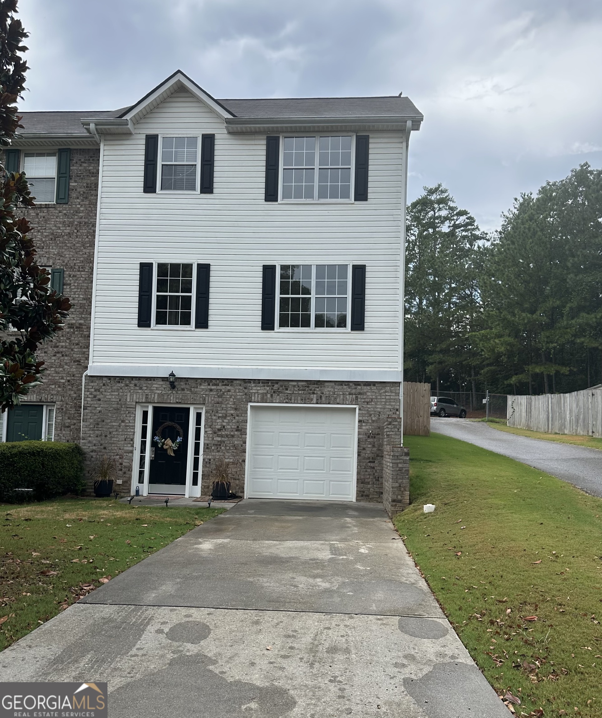 This townhome is OVER THE TOP!! You won't find a nicer one around at this price!! The large backyard is fenced and perfect for children and pets! Features include a drive under garage with a huge storage area in the rear, luxury vinyl flooring, zoned HVAC system, fresh paint and much more! The appliances are like new and ALL are included. The upper level features two spacious bedrooms, each with their own en-suite baths. Don't miss this great opportunity to make your homeownership dreams come true!!
