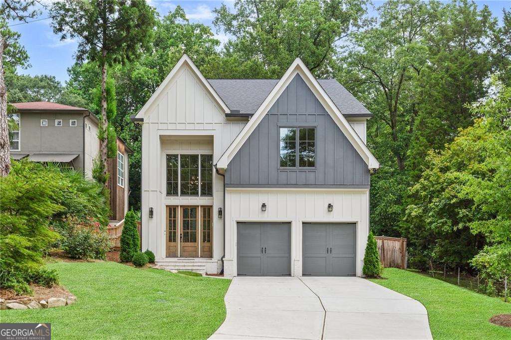 Tucked into the heart of Brookhaven Fields, this 5-bedroom, 4-bathroom home offers comfort, function, and style in one of the city's most sought-after neighborhoods. From the moment you enter the two-story foyer, you'll notice the warm hardwoods that flow throughout the main level, setting the tone for a welcoming and versatile floor plan. The bright white kitchen is the heart of the home, featuring custom cabinetry, high-end appliances, a gas cooktop, double ovens, a generous island, and a sunlit breakfast area. With open views to the family room-complete with a fireplace, built-in shelving, and oversized windows-it's the perfect space to gather and unwind. A separate dining room, built-in bar, mudroom, and a main-level bedroom (ideal for guests or a home office) add to the thoughtful layout. Upstairs, the oversized owner's suite is a true retreat with hardwood flooring, a spa-style bath with soaking tub, glass-enclosed shower, dual vanities, and a walk-in closet. Three additional bedrooms complete the upper level-two sharing a Jack-and-Jill bath, and one with a private en-suite. The upstairs laundry room adds convenience where it matters most. Step outside to enjoy the covered back patio with a cozy fireplace and room to relax, all surrounded by a beautifully landscaped yard. Just a short stroll to the new Parkside on Dresden development-this home truly delivers on location and lifestyle.