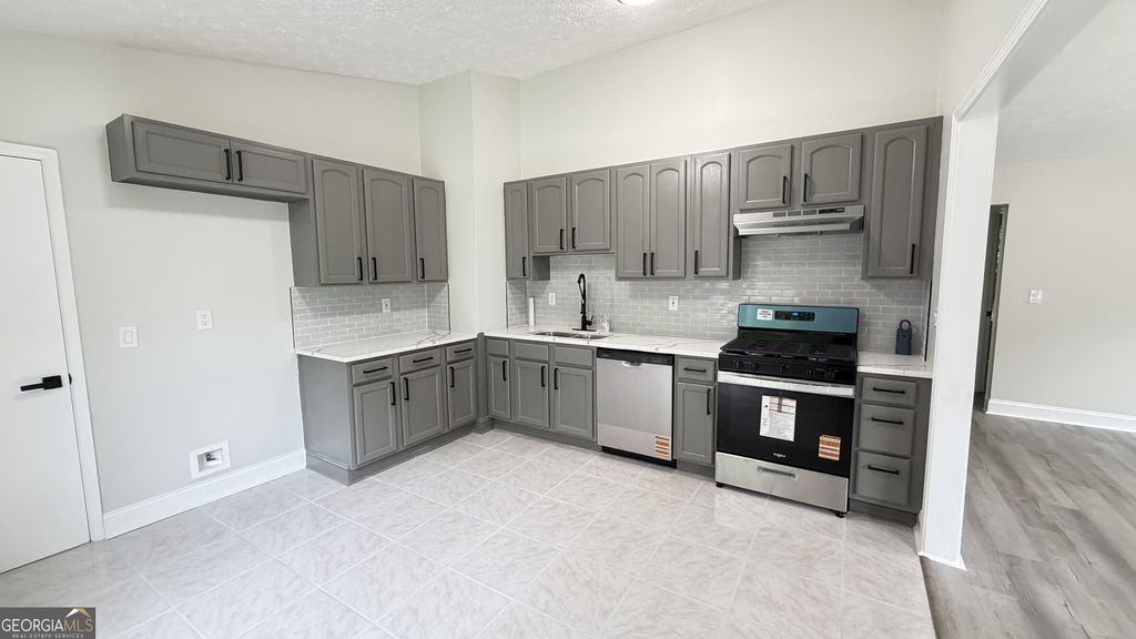 Photo of 733 Inland Way, Lilburn, GA 30047 (MLS # 10754688)