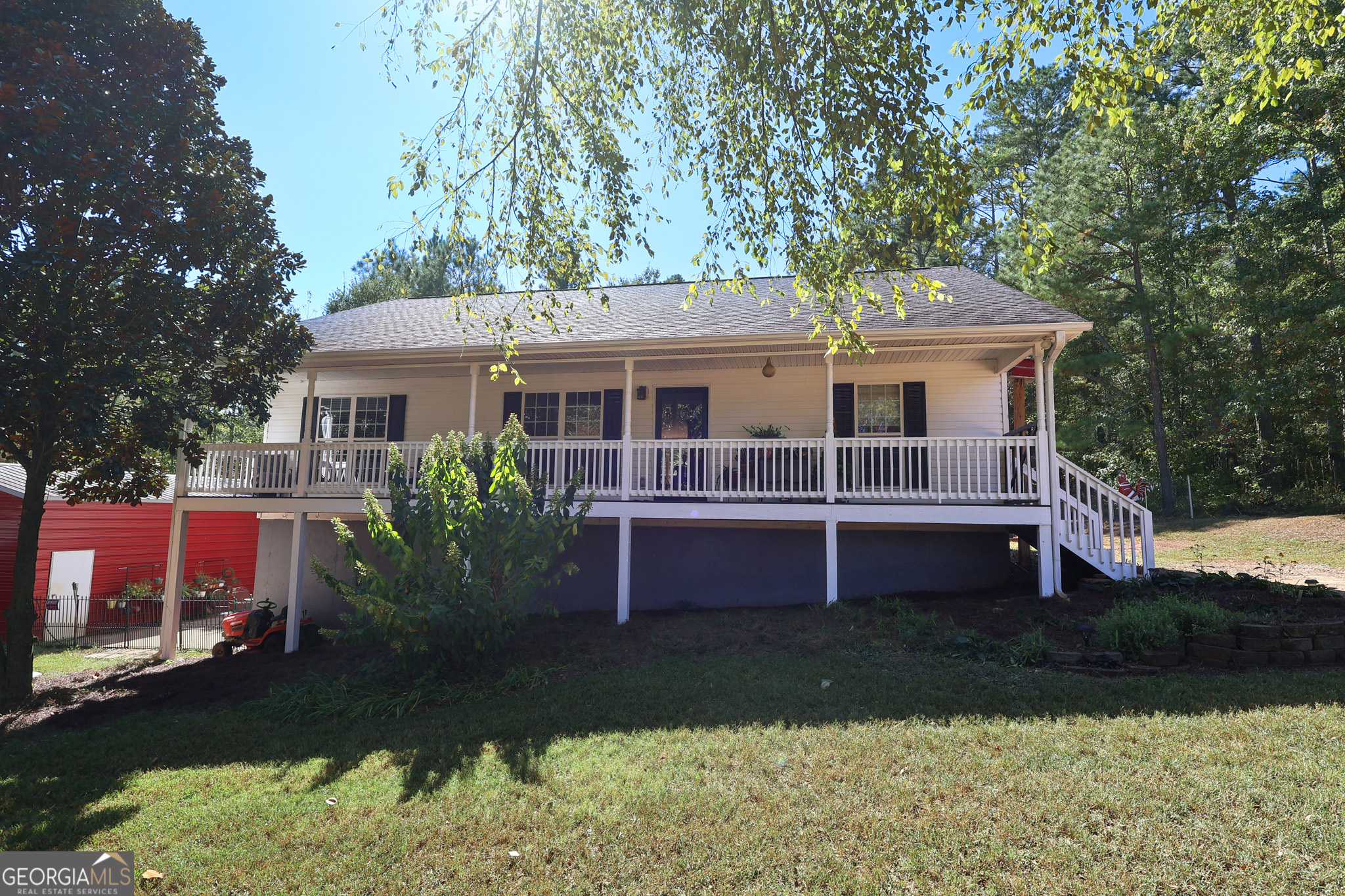 Welcome to this ranch home with a fully finished basement, offering room for everyone and everything you love. The main level features an open-concept layout with a family room that flows easily into the kitchen and dining area - perfect for everyday living and entertaining- as well as a master suite and 3 additional bedrooms and full bath. Relax on the rocking chair front porch and take in the peaceful surroundings, or enjoy the backyard with plenty of space for a garden. A detached outdoor storage shed provides even more room for tools, equipment, or recreational gear. The finished basement adds valuable living space, complete with a full bathroom and plenty of space for a media room, game room, or bedroom and additional area for storage or hobbies. Whether you're hosting movie nights or need room for guests, this level delivers both function and flexibility.
