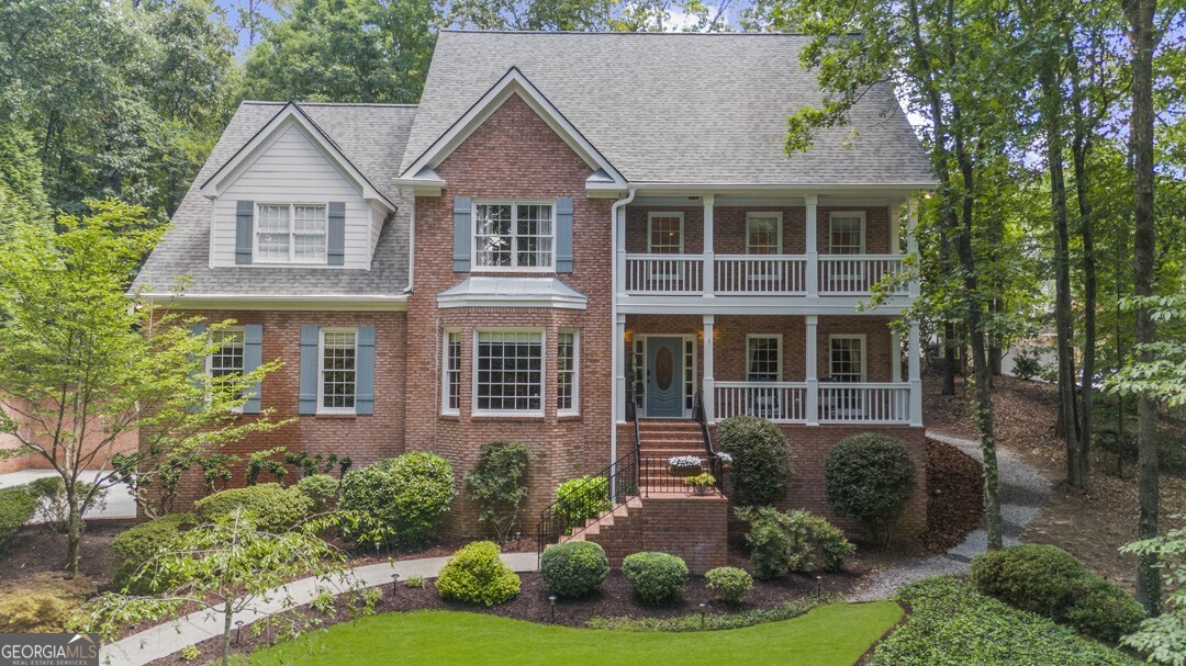 Welcome to 2020 Shallowford Park Manor, a truly special home tucked away in one of Roswell's most sought-after neighborhoods. Situated on a beautifully private and secluded 1.33-acre lot with tranquil water views, serene views of deer, songbirds, and other wildlife. This home is located in the desirable Shallowford Park swim/tennis community, 5-minutes from Historic Roswell, the Chattahoochee River, Rowell Rec park, shopping, dining, and top-rated schools (Mountain Park Elementary, Crabapple Middle, and Roswell HS). Boasting a rare 6-car garage (including two tandem spaces), this home is an entertainer's dream with a massive courtyard perfect for pickleball, basketball, corn hole, and more. Enjoy the outdoors from the expansive Trex back deck, complete with aluminum handrails and a beautiful stone fire pit. Step inside to a dramatic two-story foyer, site-finished hardwood floors, and a thoughtful, open floor plan. The renovated kitchen (2020) includes high-end soft-close cabinetry, quartz countertops, and stainless appliances (gas range), opening to a soaring fireside living room with a wall of windows that flood the space with natural light. The main level also offers a large office or optional bedroom, and an oversized bedroom suite with private deck access and updated en-suite bath. Also on the main level is an oversized bonus room above the garage, offering endless possibilities, perfect for a game room, children's playroom, or additional family living space. Upstairs you'll find three spacious bedrooms and two full baths, including a luxurious owner's retreat with fireplace, sitting room, enormous custom closet, and spa-style bath with soaking tub and walk-in shower. Additional highlights include a New roof (2025), Exterior painted (2025), HardiePlank non-rot siding, Re-finished hardwoods (2023), Large pantry/laundry combo, and an Unfinished basement with endless potential. Don't miss this incredible opportunity to own a private estate in one of Roswell's most established and picturesque neighborhoods.