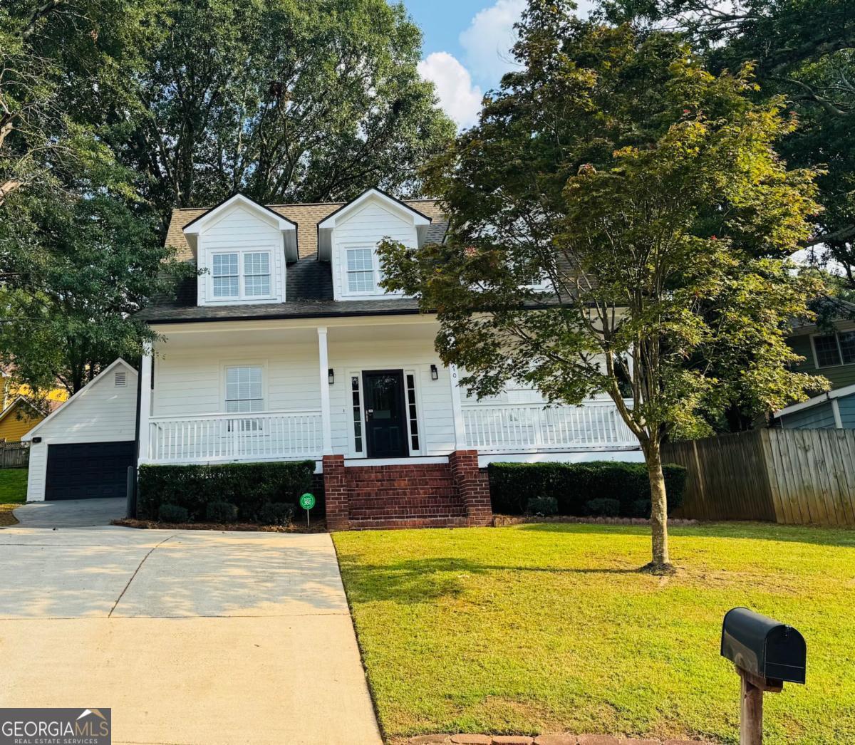 This beautifully maintained 3-bedroom, 2-bath home offers style, comfort, and convenience in a prime location if you are looking to be in or around the beltline. Step inside to find a spacious 2-story living area filled with natural light, a separate dining room that can also serve as a home office, and gleaming hardwood floors throughout the main level. The kitchen features white cabinets, granite countertops, and a gas stove-perfect for cooking and entertaining. The primary suite is conveniently located on the first floor and includes a soaking tub, separate shower, and generous closet space. Upstairs, you'll find two additional bedrooms and a full bath, offering privacy for family or guests. Enjoy the outdoors on the backyard deck or take advantage of the full-length rocking chair front porch. Detached 2-car garage with extra storage space above and parking for 6+ cars. Recent updates include a new roof, (replaced 4 years ago), hot water heater (3 years old), fresh interior and exterior paint, and professional squirrel-proofing, making this home truly move-in ready. With over 1700 sq ft of living area this home has room for the whole family. Located just minutes from shopping, downtown, and major interstates, this property combines modern upgrades with everyday convenience.