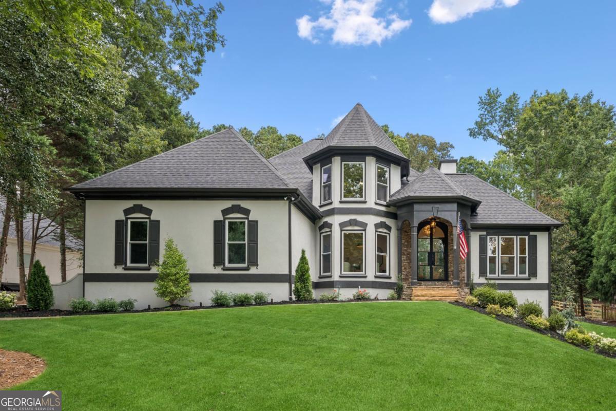 Welcome to 6730 Polo Drive-a completely reimagined 5-bedroom, 6-bathroom showpiece in the highly desirable Polo Fields community. Set in the heart of West Forsyth's premier school district, this estate blends ultra-luxury finishes with timeless design and effortless functionality. From the moment you enter, you'll notice the meticulous attention to detail. The home's open and airy layout features celebrity-inspired interior design, hand-selected to mirror some of the world's most elite homes. Think flooring modeled after Hollywood celebrity estates and bathroom tilework inspired by some of the most luxe homes in Atlanta. Every inch has been elevated-from the custom oak wood cabinetry and brushed gold finishes to the striking black accents that bring bold sophistication throughout. The chef's kitchen is a masterpiece of both form and function, equipped with high-end appliances, an oversized island, and a unique built-in dog bowl with a running water feature, so even your pets live in luxury. The primary suite offers a resort-like escape, complete with an oversized designer closet perfect for fashion lovers, influencers, or anyone with a passion for style. The main-level deck offers the ideal setting to unwind, and it's made even more stunning by a panoramic sliding glass patio door that fully opens the space-blurring the line between indoor and outdoor living and allowing natural light to flood the home. And now, let's talk about what truly sets this property apart: the backyard. This home sits on nearly 1 full acre of professionally installed flat artificial turf-a rare find in Polo Fields and an entertainer's dream. Whether you're hosting lively weekend BBQs, neighborhood games, or simply enjoying the outdoors with family, this backyard delivers unmatched lifestyle potential. A professional half-court basketball court gives athletes of all ages room to play. A fully functional pickleball court brings the country club experience home. A custom putting green adds sophistication for golf lovers. A sprawling open turf field invites backyard soccer matches, football games, or simply wide-open space to roam. This outdoor space is low maintenance, high impact, and truly unforgettable-a resort-style escape that redefines luxury backyard living. As a bonus, the basement remodel is already underway-act quickly and you can help design the final layout. Whether it's a home theater, gym, second kitchen, guest suite, or all of the above, it's your chance to personalize this already extraordinary home. 6730 Polo Drive is more than a home-it's a lifestyle. Luxury. Design. Location. Outdoor living perfected. Schedule your private showing today and see it in person.