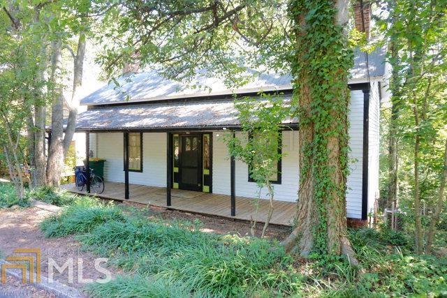 Artfully renovated in the highly desirable Pulaski Heights neighborhood, this 1880 s-era home features a large rocking chair front porch, one bedroom with fireplace, one bathroom, a kitchen, a large living room with fireplace and a private back deck with additional lower level rooms for expansion. Notable features of this home include handpainted walls and cabinets by local artists Lamar Wood and Rebecca Wood, beautiful wooded views from the back deck and original wood and tile work. Buyers desirious of in-town living should consider this rare opportunity in the Pulaski Heights neighborhood. Only seconds from Downtown Athens and The Bottleworks and just a short walk to Chase Street Elementary.