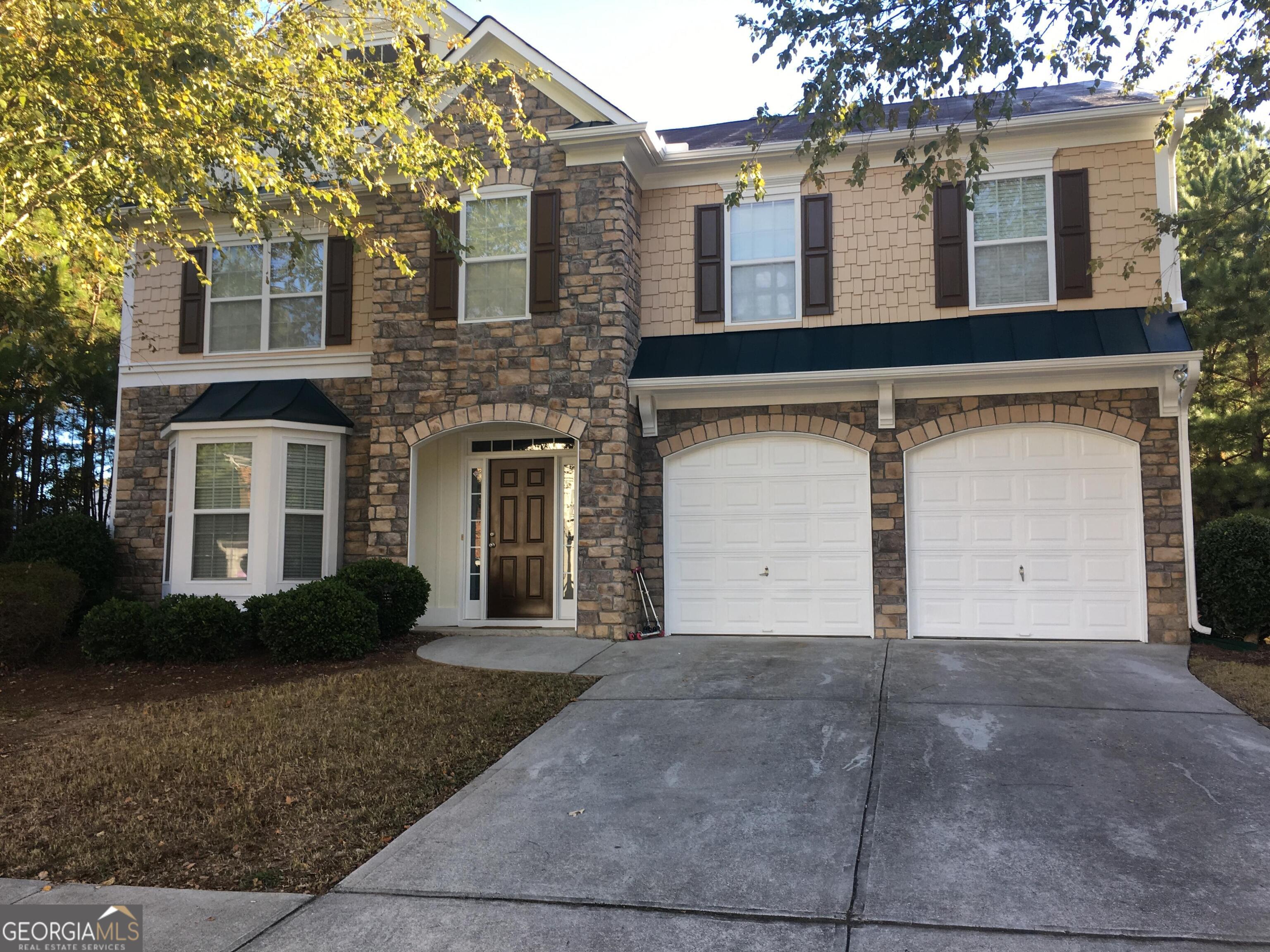 Welcome to this charming home located in Loganville, GA. This property features five spacious bedrooms and two and a half well-appointed bathrooms. The inviting living area offers ample space for relaxation, while the huge kitchen boasts modern ss appliances and plenty of storage. Brand new granite countertops, newly painted cabinets. New ss dishwasher and disposal. All new LVL installed on first floor. Nice patio for entertaining and grilling steps away from kitchen. New high quality carpeting installed upstairs. Primary suite is huge with a tray ceiling, sitting area, approx 10 x 10 closet, bath with soaking tub, shower, dual sinks and granite counters. Hall full bath is also newly tiled along w new granite counter. Four bedrooms all have ceiling fans