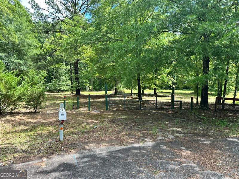 Private cul-de-lot perfect to build on. Septic system already installed and county water meter in place. One large carport built that is large enough for an RV or Camper. Grandfathered in for a manufactured home. 230 Vaughn is also available with a manufactured home on it with 4.46 acres. providing a contiguous 6.72 acres. Package discount available.