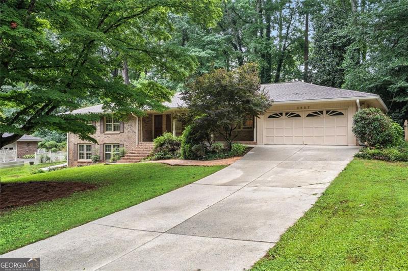 If you've been hunting for a home in Tucker, but can't convince yourself to settle for a Cubicle-Sized Primary Suite and a Tiny, Closed-Off Kitchen ... Buckle. Up. * You'll be blown away by the Primary Retreat, which spans a Grand Total of just over 575 ft2. The Primary Bedroom's Vaulted Ceiling and Sitting Area enhance the already spacious aesthetic. Morning Routines get a distinct upgrade in the stunning Primary Spa - roughly the same size as the Original Primary BEDROOM - sporting Carrara Marble Vanities, a Soaking Tub, large Tile Shower, and Commode Room. Good luck filling up the Waltz-In Primary Closet! * The Living Area has a fantastic flow, as it's Open, yet not so much that it becomes one oversized echo chamber. Instead, it seamlessly ties together the Living Room, Dining Room, & Kitchen. * The Dining Room helps define spaces without separating them. * At Shindig Central, you'll enjoy being able to fulfill all Host Kitchen-Duties without missing the action. The Kitchen offers a generous amount of (Granite) Counter Space and enough Cabinetry to leave a Maximalist room to expand. * Don't miss the Coffee Bar in the Extended Breakfast Area - a Side Door provides easy access to the Patio. * Tired of climbing stairs to do the Laundry? - the Laundry Room on the Main Floor completes your Stepless Ranch Experience. * If you love Natural Light, you'll love the Sunroom. * After throwing your Housewarming Party, you'll find that the Hall Bathroom's accessibility improves your Guests' Experience, over the common 1960's Jack & Jill Setup. * Two Secondary Bedrooms round out the Main Floor, reminding you that there is No Carpet to remove ... ANYWHERE. * Downstairs, you'll find a Daylight Basement with a large Rec Room, Flex Room, & Utility Space. Add a Bathroom, and you'll have the perfect setup for an Airbnb (There is a Paved Walkway all the way from the Driveway to the Basement Door!). * When you have just over a 1/2 Acre Lot, you have room to breathe. Dual Patios give you plenty of space to move the Party to the great outdoors, and the Lawn is ready for a good Cornhole or Spike Ball Tournament. To get a sense of how far back your Lot extends, check out the Trail back to the Shed! * Tired of Carports and ready for a Garage so you can keep your Auto looking great for more than a few minutes? Done. * What about tackling a new set of Fitness Goals? - Henderson Park is just a few minutes away. EXTRAS: Zero Carpet, just Real Hardwood Floors, Tile, & Concrete. 30-Year Architectural Roof (2023), 4-Zone Trane HVAC (Replaced 2024), Water Heater (2021). * You don't see Ranches with 2,161 ft2 on the Main Floor very often. Enjoy the Pictures, then pay us a visit at 3557 Hershey Lane to see what "stellar" looks like in-person!