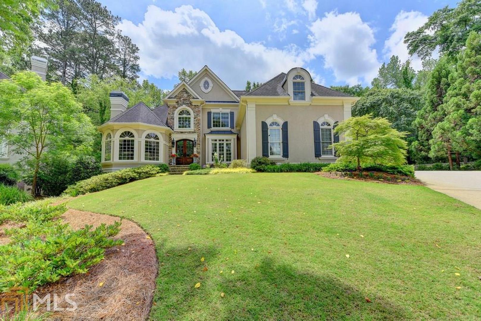 Lovely European Classic in sought after St Ives! Bright and welcoming floorplan, large chef's kitchen with custom cabinetry, Quartzite countertops and huge island open to beamed keeping room with cozy fireplace. Master suite on main with french doors leading to gorgeous private backyard oasis, complete with tranquil water feature. Three large bedrooms with 2 full baths upstairs. Fully appointed terrace level with entertaining space, wet bar and bedroom with full bath allow access to backyard retreat. Perfect home for entertaining - this is a must see!