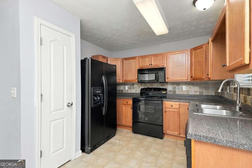 Photo of 935 Magnolia Garden Walk, Mcdonough, GA 30253 (MLS # 10846823)