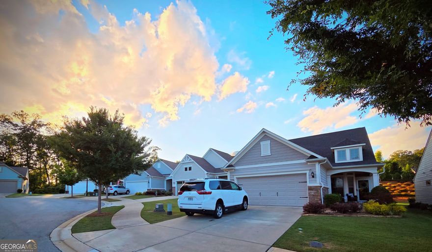 Welcome to this beautifully maintained 3-bedroom, 2-bath 1.5-story home located in the prestigious 55+ active adult community of Del Webb Chateau Elan in Hoschton, GA. Situated in a quiet cul-de-sac, this thoughtfully designed home offers an open-concept layout with beautiful hardwood flooring throughout the main level. The primary suite is located on the main floor and features a fully renovated en-suite bath with a large, luxurious zero-entry shower. Two additional bedrooms, including a versatile flex room, provide space for guests, a home office, or hobbies. A bonus room on the upper level adds even more flexible space for an extra bedroom, media room, craft room, or additional guest area.    Enjoy natural light all year round in the sunroom addition, or step outside to a covered patio that's perfect for entertaining or relaxing. The home also features a two-car garage with built-in storage and a professionally landscaped yard, fully maintained by the HOA for low-maintenance living.    Del Webb Chateau Elan offers resort-style amenities including indoor and outdoor swimming pools, a clubhouse with organized social events and hobby clubs, a state-of-the-art fitness center, tennis and pickleball courts, bocce ball, and scenic walking trails. Conveniently located near shopping, dining, healthcare, and just minutes from the Chateau Elan Winery & Resort, this home offers the perfect blend of comfort, convenience, and community.    Don't miss your opportunity to live in one of Georgia's most sought-after active adult neighborhoods!