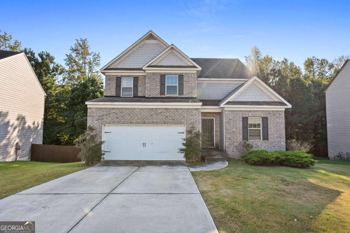 Welcome to 439 Scotland Dr, a spacious 4-bedroom, 2-bath home in the desirable Dallas, GA community. Offering 2,220 sq. ft. of living space, this single-family detached residence sits on an 8,712 sq. ft. lot and features a 2-car attached garage. Inside, you'll find a cozy fireplace, walk-in closet, pulldown attic stairs, and a thoughtful layout across 1.5 stories. The home is equipped with smoke and carbon monoxide alarms for added peace of mind. Enjoy neighborhood amenities including a clubhouse, playground, pool, tennis courts, and a welcoming association-all for just $41/month HOA. With a perfect balance of comfort and community living, this home is ideal for families seeking space, convenience, and lifestyle. Don't miss it!