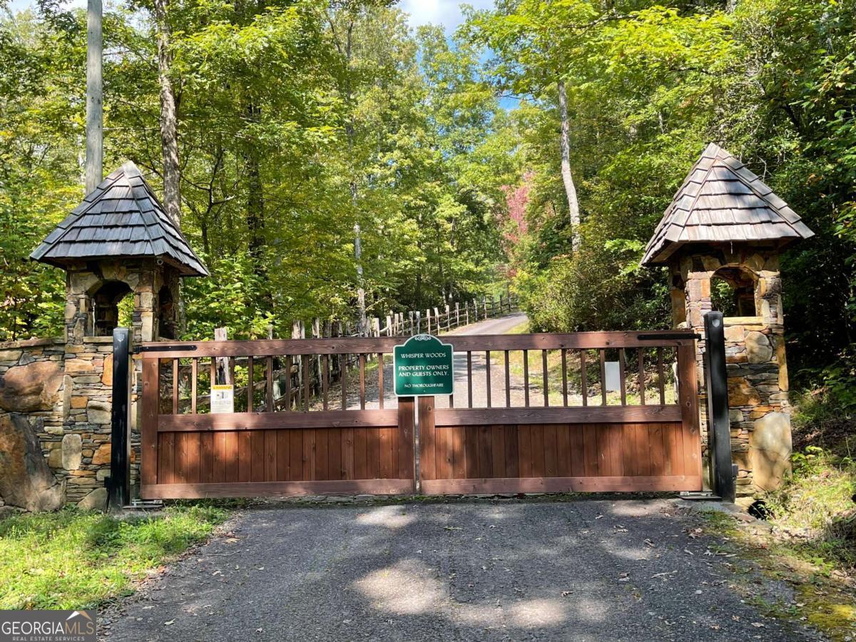 Build your dream home on this beautiful 4.29 acre lot. Whisper Woods offers natural beauty & wildlife everywhere. Enjoy beautiful North Georgia Mountain views. Private, quiet gated community.