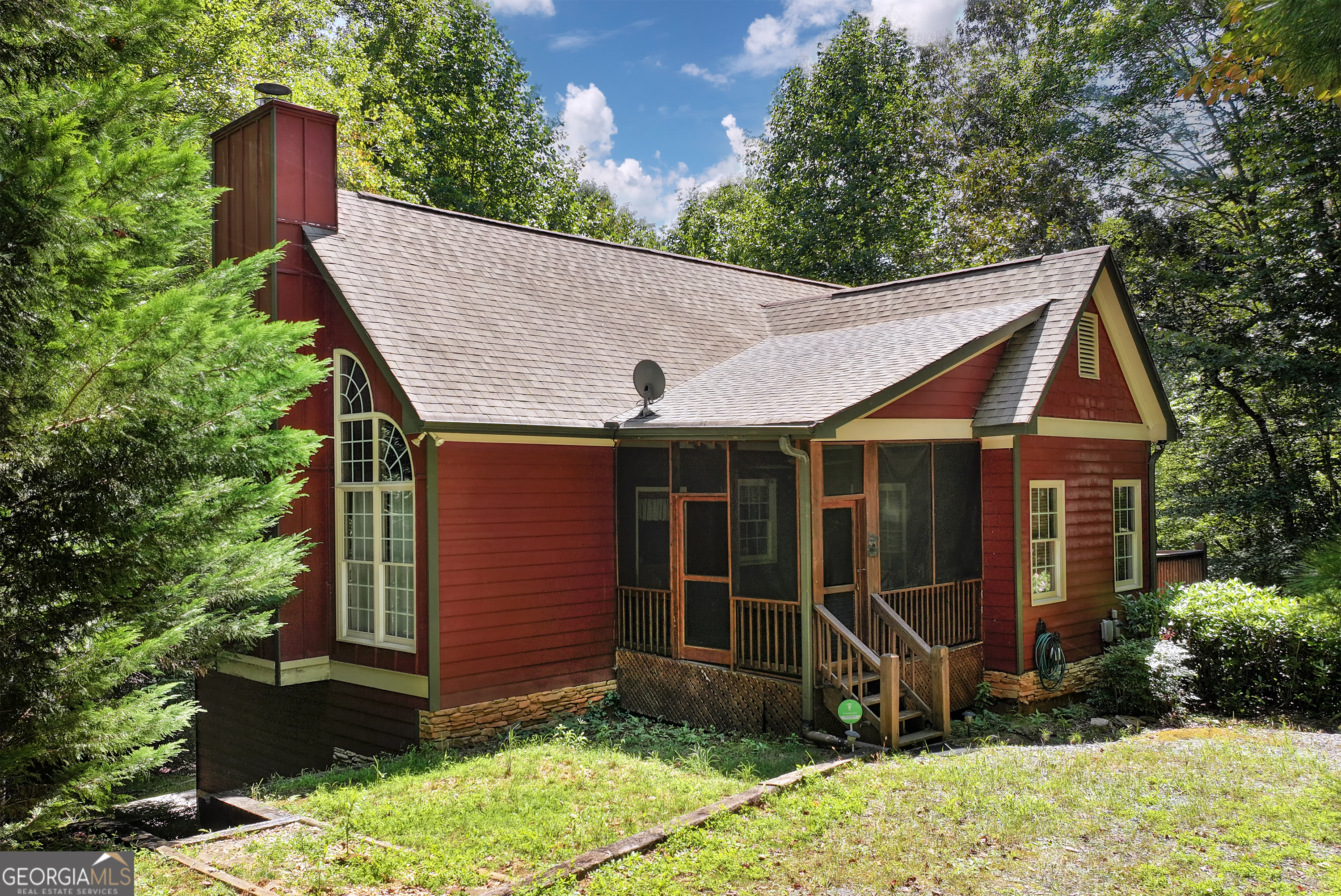 Welcome to your mountain retreat in the heart of Coosawatee River Resort! This charming cabin greets you with a cozy screened-in front porch, perfect for sipping morning coffee while enjoying the sounds of nature. Step inside and experience the warmth of a true cabin feel with pine floors, tongue-and-groove walls, and vaulted ceilings. The main level offers an open kitchen, breakfast area, and living room centered around a stunning stacked stone, wood-burning fireplace-the perfect gathering spot on cool mountain evenings. Two bedrooms are conveniently located on the main floor, including the primary suite with an en-suite bath and private deck, and a spacious guest bedroom with an adjacent full bath. Upstairs, a versatile loft area provides additional sleeping space or a cozy reading nook. The unfinished basement has already been drywalled and is ready for your final touches-whether you envision a game room, extra bedrooms, or a media space. From here, walk out to the patio overlooking a private wooded setting, offering peace and seclusion. Located in the sought-after Coosawatee River Resort, you'll enjoy a wealth of amenities including river access for fishing, tubing, and kayaking, three community pools (one indoor), tennis courts, fitness facilities, parks, and hiking trails. Whether you're looking for a full-time residence, vacation getaway, or short-term rental opportunity, this cabin offers both charm and potential.