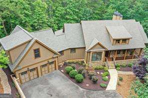 You will find ultimate privacy at 838 Wildcat Trail. This home is located at the end of a cul-de-sac in the highly sought-after Wildcat neighborhood in Big Canoe. Sellers custom-built the home and have made thoughtful improvements during their ownership to maximize enjoyment. Ease of maintenance was top of mind. Some incredible features include custom, extra-large closets in bedrooms and huge walk-in kitchen pantry, laundry room with even more storage, maintenance-free trex decking with stylish metal railings, dog wash room, solar shades, plantation shutters, EZ Breeze screens on porch and terrace level-to keep the pollen out but let the cool breeze in, whole house generator for peace of mind, long level driveway with ample parking and easy access to the North Gate and Wildcat dog park. Interior has been freshly painted. Home is immaculate and move-in ready. Nothing to do here but unpack and start enjoying the Big Canoe lifestyle.