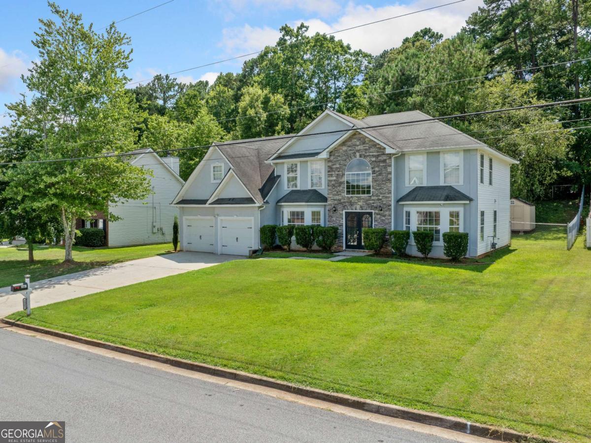 Welcome to this stunning 5-bedroom, 2.5-bathroom home in Decatur, GA, offering the perfect blend of modern updates and classic charm. The exterior features a beautiful combination of stucco and stone, setting the tone for the elegant interiors inside. This recently renovated home boasts a spacious, open layout with plenty of natural light. The gourmet kitchen is a chef's dream, featuring sleek quartz countertops, updated cabinetry, and stainless steel appliances. Enjoy a seamless flow into the cozy family room, ideal for entertaining or relaxing. The main level features a convenient bedroom, perfect for guests or a home office, and separate formal living and dining rooms for those special occasions. Retreat to the expansive owner's suite, complete with a private sitting room and a trey ceiling that adds a touch of sophistication. The spa-like en suite bathroom offers a luxurious soaking tub, separate shower, and dual vanities-your own private oasis. Step outside to the fenced-in, level backyard, perfect for children or pets to play, gardening, or simply unwinding in privacy. Don't miss the opportunity to make this beautiful home yours!