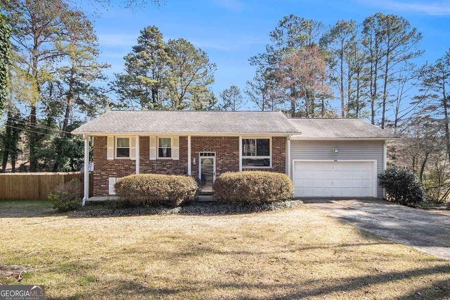 This inviting 3-bedroom, 2-bathroom split level home offers a comfortable and functional layout. The main level features a bright eat-in kitchen, a separate dining room, two generously sized bedrooms, and a full bathroom. On the lower level, you'll find the private primary bedroom complete with an ensuite bathroom, as well as a cozy family room and convenient laundry area. Enjoy the outdoors with a spacious patio, perfect for entertaining, and a newly installed wood fence providing privacy. Additional amenities include a two-car garage for your convenience. Don't miss out on this lovely home!