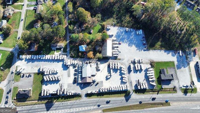 Calling all investors to bring your business to Battefield Parkway in Ringgold! This property offers appox. 7 acres all fenced in on Battlefield Parkway with 700 ft of road frontage on the parkway. The main building is 4200 sq. ft. with office space and a show room. The second building is a large garage/workshop with 7200 sq. ft. Currently the business is the home of of Parkway RV Center. The business and inventory are being sold separately. Call listing agent for more information. Agent is related to the seller.