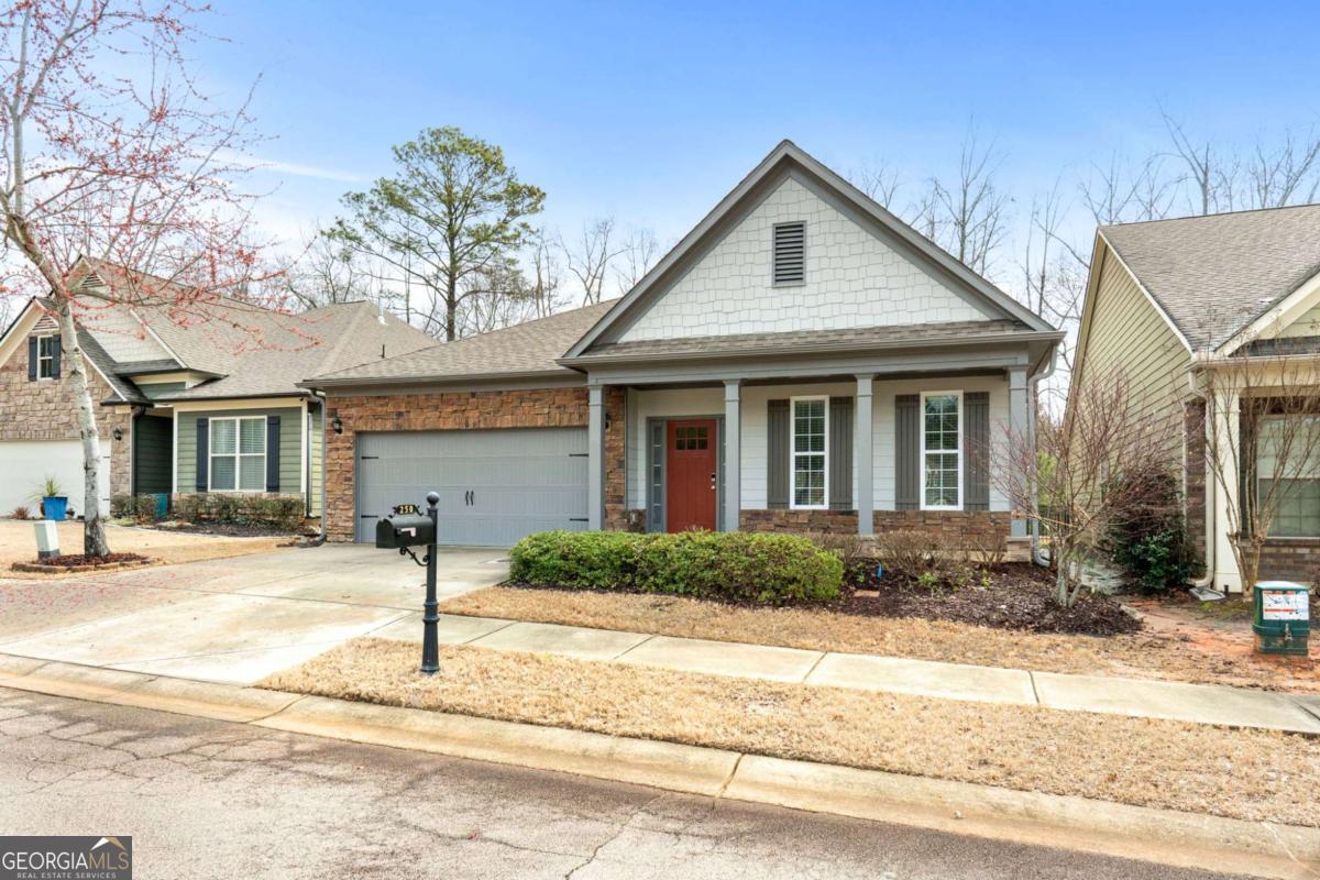 Welcome to The Villas @ Heron Bay, a thriving community in Spalding County that seamlessly blends tranquility with modern convenience. This charming Craftsman-style home is designed to impress and is perfect for any stage of life whether you're starting a family, downsizing, or retiring. Offering a unique floor plan, this home features 3 spacious bedrooms thoughtfully positioned for privacy, along with 2 full baths. As you step inside, the foyer leads into the formal dining/living area, a versatile space that can serve as an office, gym, man cave, or playroom for the kids. The open-concept kitchen is perfect for cooking and entertaining, featuring a breakfast bar, a second dining area, recessed lighting, granite countertops, stainless steel appliances, a gas stove, a pantry, and ample cabinet space. Adjacent to the kitchen, the inviting family room boasts vaulted ceilings and a cozy fireplace, creating a warm and welcoming atmosphere. On the right side of the home, the elegant owner's suite offers a retreat-like experience with beautiful tray ceilings and a spa-like ensuite bath complete with a soaking tub, tiled shower, double vanities, and a spacious walk-in closet. Step outside to the extended patio, which overlooks the golf course while still providing a natural buffer for privacy-an ideal setting for morning coffee or a BBQ with friends and family. This home has been recently updated with New Interior and Exterior paint, Recessed lighting with dimmers, New carpet, New Tile in the laundry and hall bath, and New stainless steel appliances. Beyond the home itself, The Villas @ Heron Bay offers incredible community amenities, including scenic walking trails, tennis courts, gym, a zero-entry pool with a splash pad, and the 1,100-acre Cole Reservoir-perfect for fishing and kayaking. Additionally, this home is located in an HOA community that provides lawn care, irrigation, trash collection, and termite protection, ensuring a low-maintenance lifestyle. Be sure to watch the virtual tour-this home is a must-see - Sell with Sasha! Buyer will receive up to $2000 in lender credits with Kristin Chisolm at Academy Mortgage.