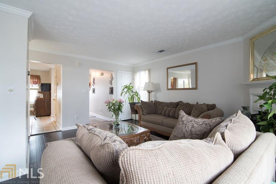 You'll love this immaculate, duplex style 2-story townhome with updates featuring new ceramic tiled flooring. This single-owner home is great for family gatherings or quiet snuggles for a more intimate setting in front of the fireplace.  With two separate sliding glass doors leading out to your deck for entertaining in seclusion by your privacy fence, all while having ample parking in the drive way for up to 5 vehicles. Situated in a friendly community with no HOA, this is sure to go fast!
