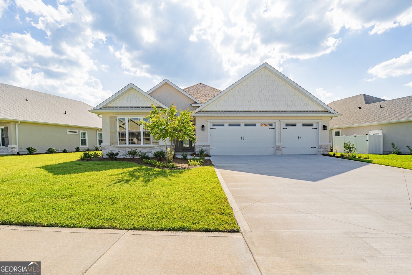 Welcome to your luxurious sanctuary in the highly sought-after, gated community of Fiddler's Cove by Sawyer and Associates! Nestled among scenic marshland with tranquil pond views in Phase 4, this exceptional home offers an unparalleled blend of comfort and elegance. Step inside to discover expansive living areas, thoughtfully designed with elegant crown molding and refined tile flooring, creating a warm and welcoming atmosphere that's perfect for both relaxing and entertaining. At the heart of the home, the chef's kitchen is a true showstopper. Enjoy top-of-the-line stainless steel appliances, custom cabinetry, and striking quartz countertops, all complemented by a spacious walk-in pantry-perfect for keeping your kitchen beautifully organized. Retreat to the primary suite, your private haven of serenity. Indulge in spa-inspired amenities including dual vanities, a gorgeous tiled walk-in shower, a soothing corner soaking tub, and a grand walk-in closet complete with custom wood shelving. Step out onto the covered lanai overlooking the peaceful pond-ideal for outdoor gatherings or quiet moments in your own backyard retreat. Professionally landscaped grounds, complete with an efficient irrigation system, enhance the beauty and ease of your outdoor living space. Experience luxury, privacy, and natural beauty-all waiting for you at Fiddler's Cove. Don't miss your chance to make this dream home yours!