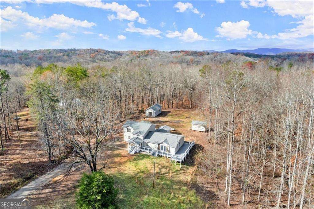 Serious seller! Submit your offer. Stunning 4-Bedroom, 4-Bath Country Retreat! Escape to your own peaceful paradise with this spacious 4-bedroom, 4-full-bath home. Whether you're looking for room to grow, space to entertain, or simply a tranquil place to unwind, this property offers it all. The home features an open and inviting floor plan with plenty of natural light, large bedrooms, and beautifully appointed bathrooms for maximum comfort. The kitchen is perfect for preparing meals with family and friends, while the expansive living areas offer plenty of space for relaxation and gatherings. Outside, you'll find a large workshop-ideal for hobbies, projects, or storage-and an additional shed for extra space or equipment. Surrounded by peaceful rural views, this property provides the perfect balance of seclusion and convenience, all while being just a short drive from local amenities. Whether you're an outdoor enthusiast, need space for your business, or just want to enjoy the serenity of country living, this home is a must-see. Come experience the lifestyle you've always dreamed of!