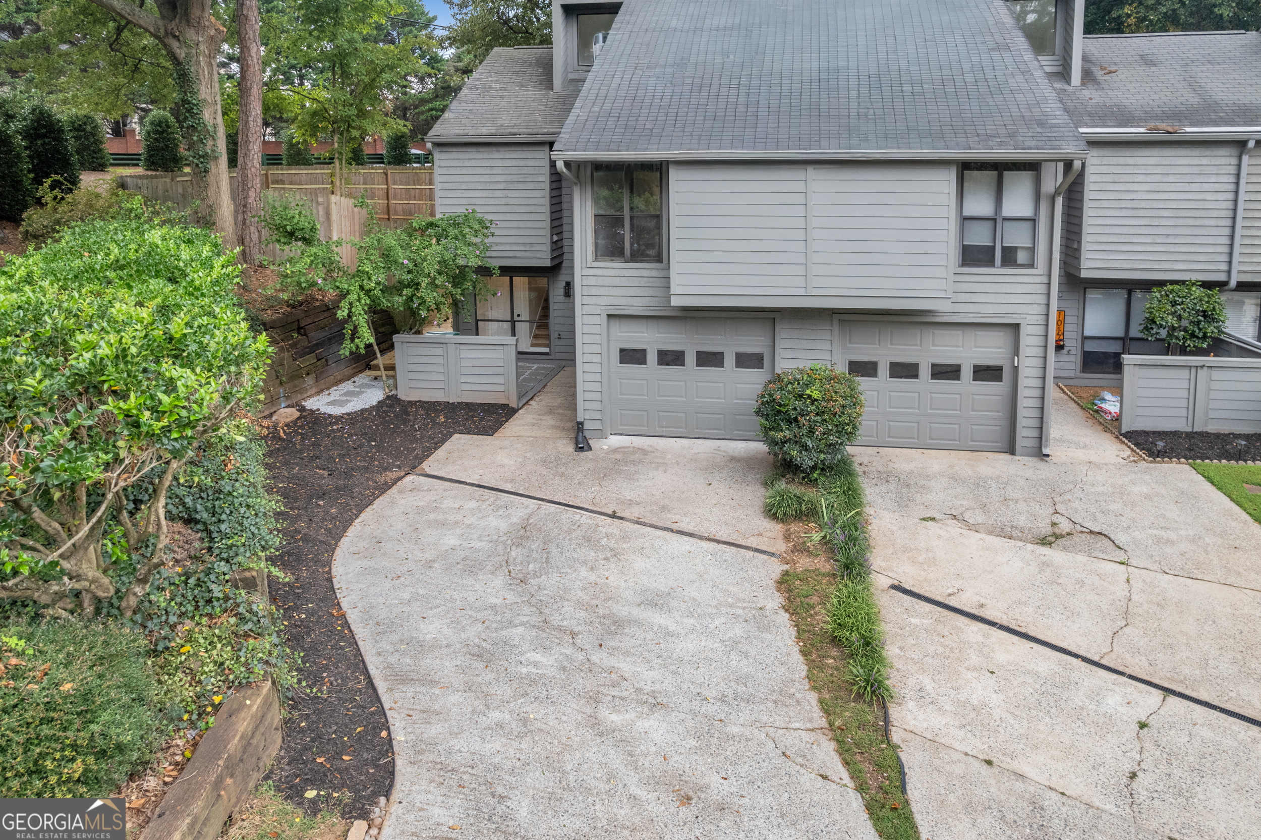 Beautifully Updated 2 Bed 2 Bath End Unit Townhome in the Heart of Smyrna! Located in the Friendly and Quiet Creatwood at Vinings Community where you can Experience Tuesday Night Food Trucks for a quick bite on Tuesday Evenings. Stepping inside, you'll appreciate the thoughtful layout that showcases a Bright & Open Main Level with a Family Room with soaring Vaulted Ceilings and a Modern Fireplace. Gorgeous LVP Flooring throughout. The Luxurious Kitchen/Dining includes an Island with quartz countertops, Beautiful backsplash, New Stainless Steel Appliances, Elegant Light Fixtures and stunning white and Carmel Shaker Cabinets. Upstairs, Retreat to the Owner's Suite with Newly Updated Ensuite Bathroom. Also, a Secondary Bedroom, Full updated Bath, and Laundry Room on separate level. An oversized Back Deck provides a space for Grilling and relaxing while overlooking a Fenced side yard and Backyard. New HVAC System, Water Heater and Fresh Exterior Paint completes the home. Take a walk to Smyrna Market Village which is only a mile away! Taylor-Brawner Park is across the street with multiple Playgrounds and a Large Green Space. This location honestly can't be beat - close to The Battery, Cumberland Mall, several Grocery Stores, Costco, and more!