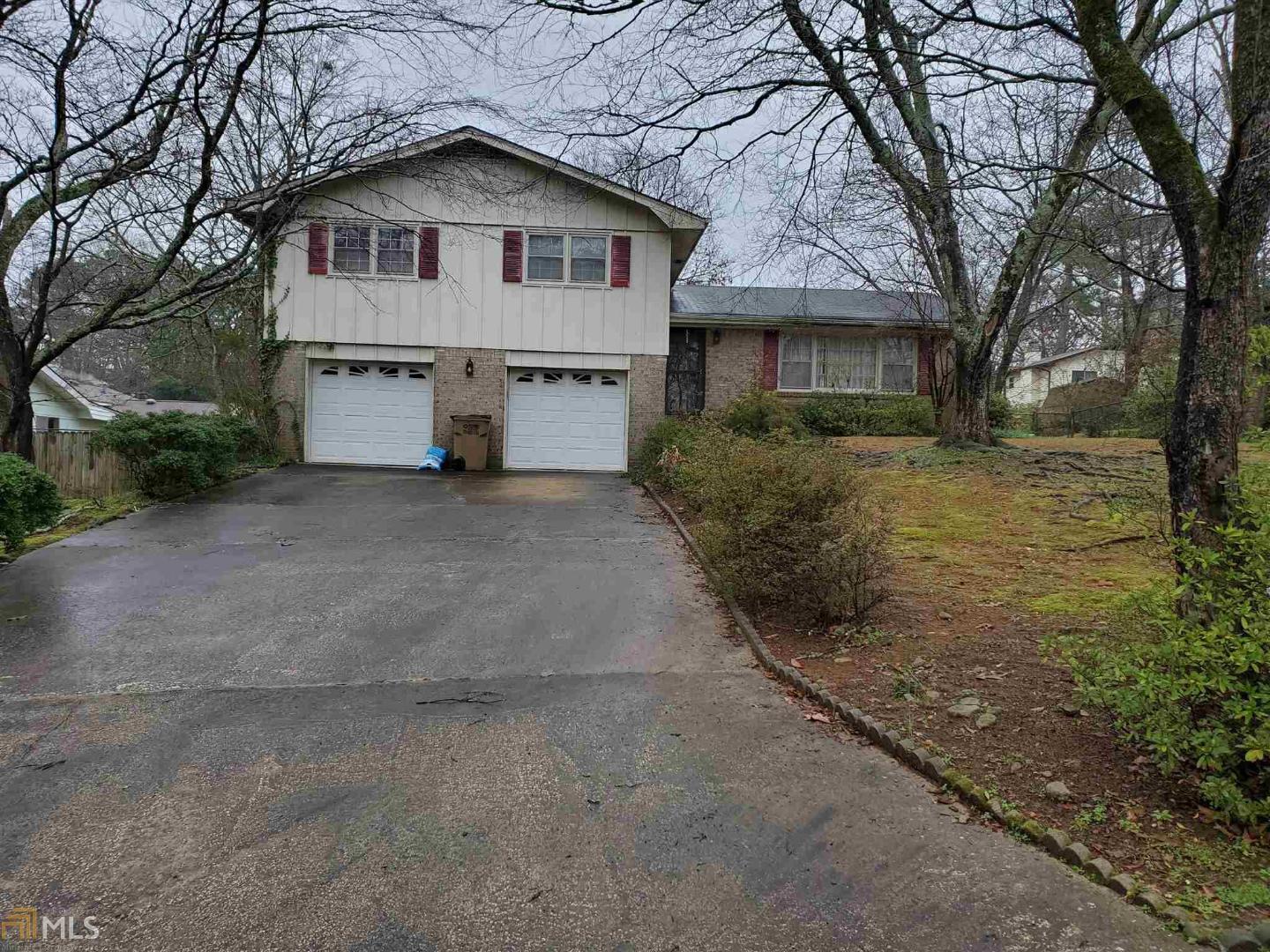 AS IS, Sold without Seller Disclosure. 4 bedroom, 2 bath, large great room with built in bookcases on brick accent wall, formal living room, formal dining room, loads of cabinets in kitchen with breakfast area, fenced backyard with patio, established landscaping; two car garage with built in bookcases. Loads of space!