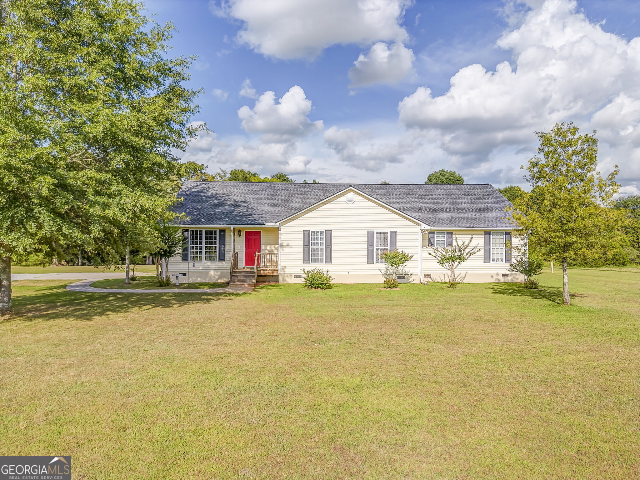 This charming country ranch sits on a spacious lot just a short drive from local shops, dining, and the conveniences of Cartersville and Rome. A large front yard offers a warm welcome, leading into an open-concept interior designed for comfort and easy living. The kitchen features abundant cabinet space, a central island perfect for meal prep or casual dining, and a seamless flow into the main living area ideal for gathering and entertaining. Comfortable bedrooms provide peaceful retreats with natural light and room to relax. Step outside to a generously sized backyard complete with a deck, patio area, and an above-ground pool-perfect for enjoying warm Georgia days or hosting outdoor get-togethers. Whether you're looking to unwind or entertain, this inviting home offers the perfect blend of privacy, charm, and accessibility.