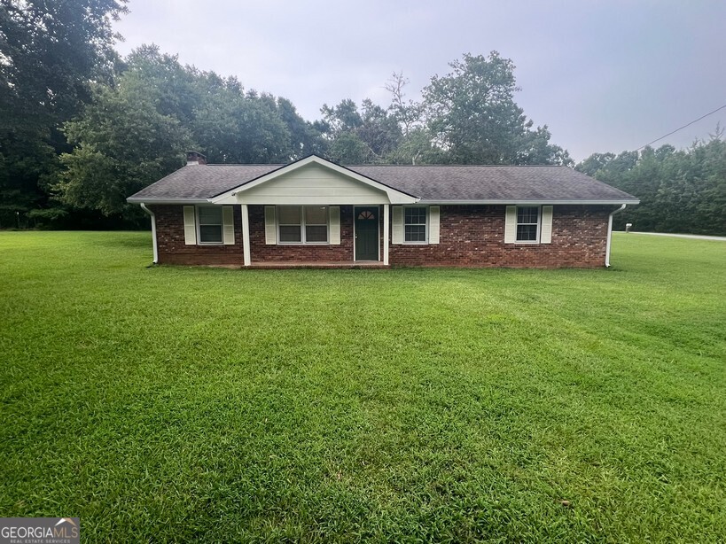 Updated & Move-In Ready 3 Bedroom, 2 Bath Brick Ranch Zoned for Mansfield Elementary and Eastside High. This charming brick ranch features a cozy fireside family room with built-in bookshelves, granite kitchen, and a breakfast/dining area. A second family room offers great flex space for a home office, playroom, or additional living area. The spacious master bedroom is complemented by two large guest bedrooms and two full bathrooms. Additional highlights include a laundry room, rocking chair front porch, detached storage building with covered pavilion, a huge yard, and a parking pad.