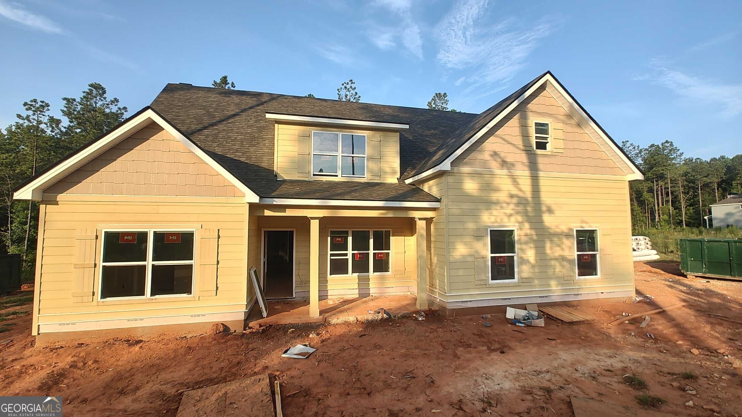 2 +/- ACRES IN NORTH TROUP COUNTY WITH TWO BEDROOMS ON THE MAIN! The Smithfield Plan features foyer opening to Dining Room. The Dining Room features trim work accent for added detail. The Family Room offers Vaulted Ceiling and wood burning Fireplace with Brick or Stone Hearth. This plan offers an open flow from Family Room/Kitchen/Breakfast Area. The Kitchen boasts shaker style cabinets, quartz or granite counters, tile backsplash, stainless appliances, and pantry. The island is a great place for serving or entertaining! On the main level, you'll find a nicely sized Owner's Suite with vaulted ceiling and can lighting. The Owner's Bathroom features tiled shower, garden tub with tile surround, double vanity, and a walk-in closet. Additionally, on the main level you'll find a guest bedroom and bathroom. On the second level you'll find a flex room ideal for playroom, media space, or office. Two guest bedrooms share a hallway bathroom featuring tiled flooring and quartz or granite counters. Each guest room is pre-wired and braced for a ceiling fan. This beautiful home features a FOAM INSULATED ATTIC, total electric construction, and architectural shingled roof. **SMART HOME TECHNOLOGY PACKAGE included for convenience** Perkins Place offers quaint living, but easy access to I-85 for commuters! Up to $6,500 toward closing costs assistance available when using builder's preferred lender!