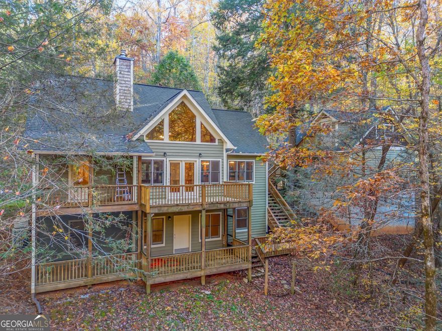 Just minutes from the scenic headwaters of Tallullah River, this very private property borders 14,700 acres of National Forest. The exterior charm is further accentuated by its elegant architectural lines, which stand as a testament to fine craftsmanship.  The expansive foyer, illuminated by an abundance of natural light, leads to a spacious living area that offers a cozy retreat. The open kitchen and dining area allow for comfortable entertaining.  The loft above the living area is a perfect study or office space and the large open room downstairs makes a great gameroom The generously sized bedrooms provide the perfect haven for relaxation and rejuvenation.  Above the oversized two car garage sits a studio space, perfect for artists.  This is a private and perfect place in the forest to call home.