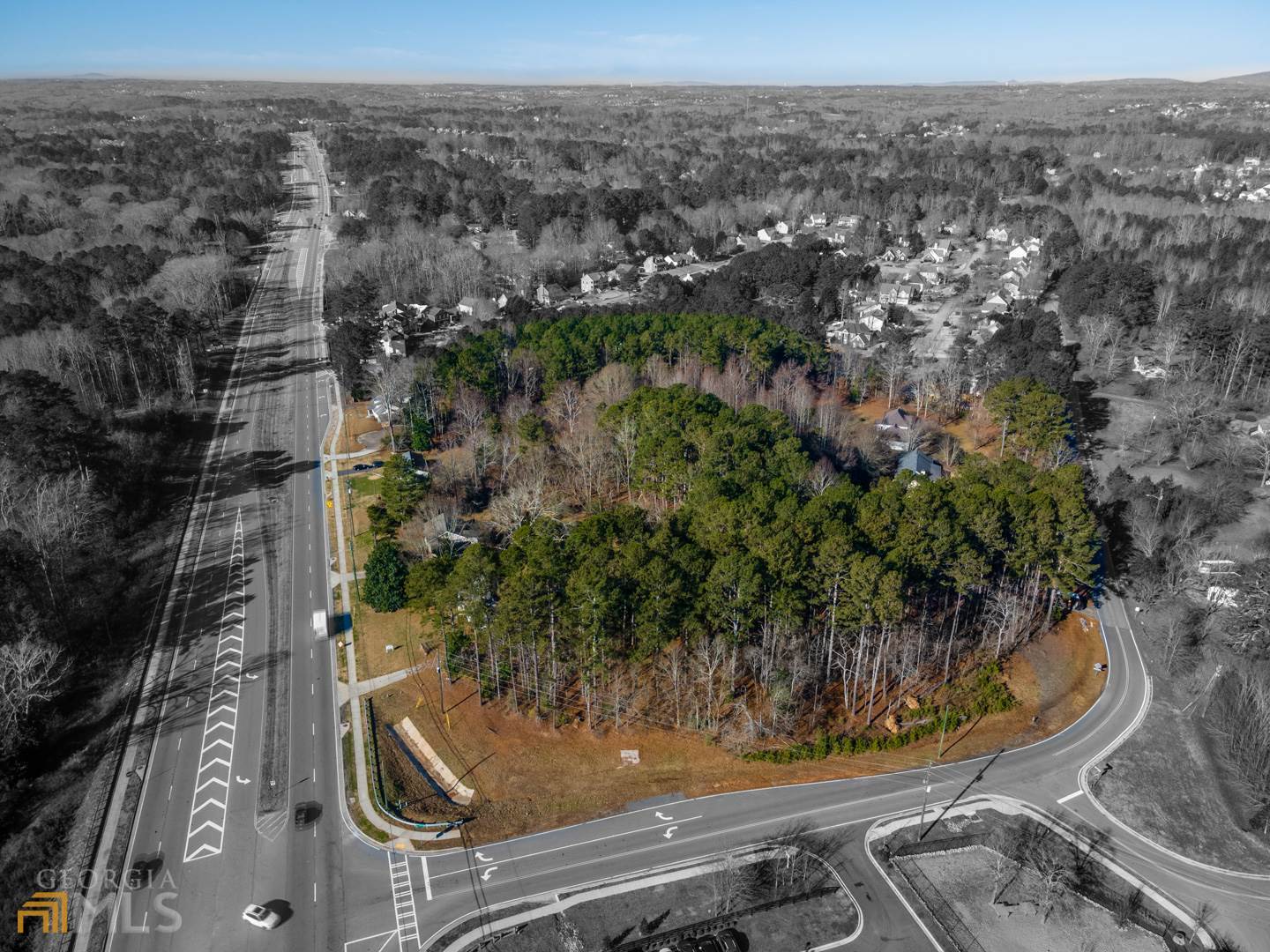 Exciting opportunity in this large corner lot assemblage offering! This almost 10 acre property includes 7 parcels that are being offered TOGETHER for the first time ever! Property takes up the corner of Nelson Brogdon Blvd (GA Hwy. 20) & Old Cumming Rd. in the TOWN CENTER OVERLAY DISTRICT of the CITY of SUGAR HILL! Hwy. 20 road frontage is approx. 635 ft. and approx. 900 ft of road frontage on Old Cumming Rd. The property is level and backs up to SEWER access opportunity (see diagram). Water, Electric, Gas, Cable, Phone is all on property. Currently zoned residential but potential for commercial or multi-family residential! The property is across the street from the newly revamped Sugar Hill Animal Hospital and yards from the upcoming Lidl grocery store and exciting and growing Sugar Hill E-Center!