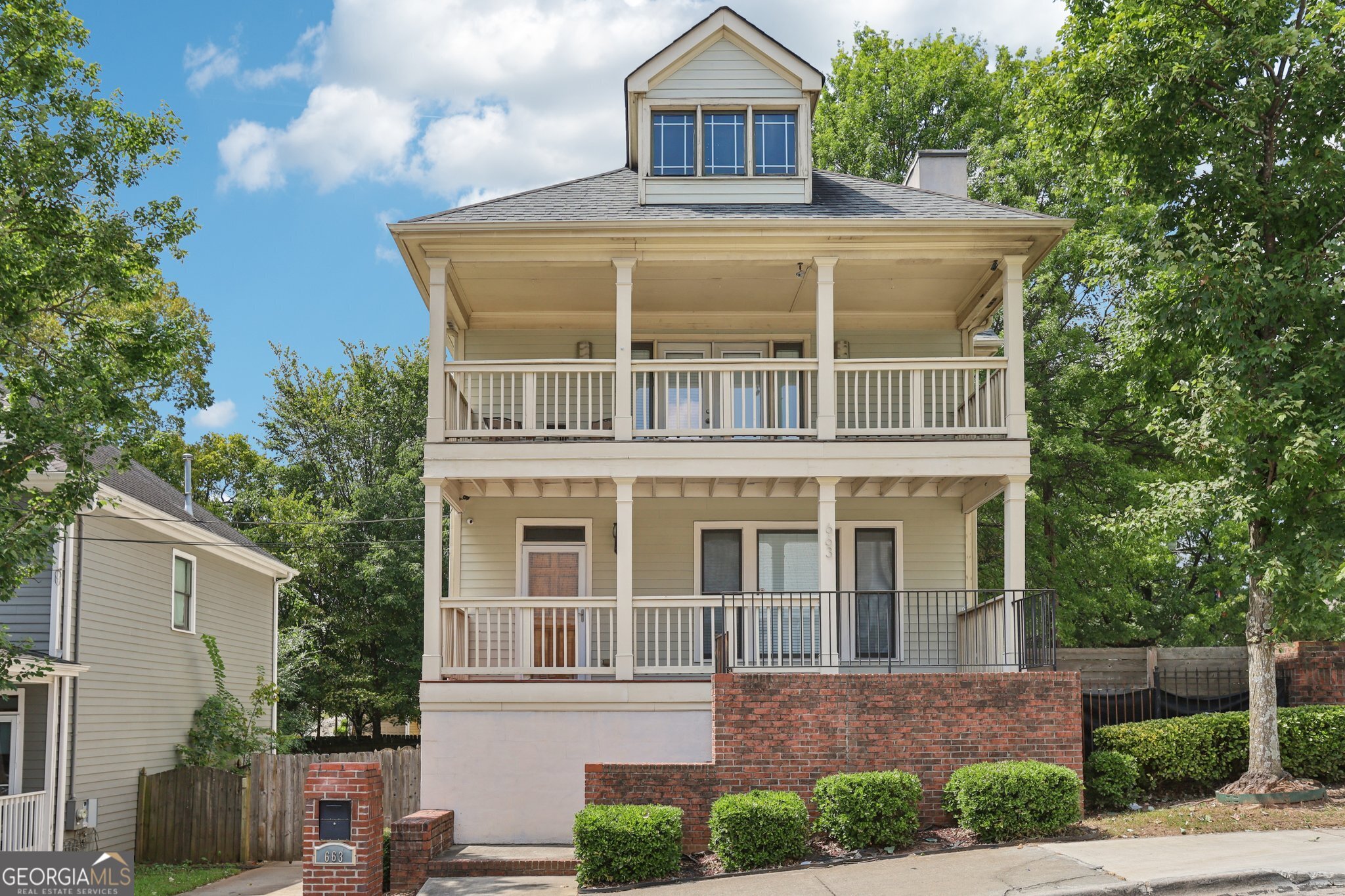 Available IMMEDIATELY either furnished or unfurnished - Rent includes WIFI & Security Camera System!! Welcome to this bright and inviting home in downtown Atlanta. This spacious property blends modern updates with timeless charm, offering a light-filled, open-concept floorplan that's perfect for both relaxing & entertaining. The main level features gleaming hardwood floors, abundant natural light, and a stylish kitchen with granite countertops, tile backsplash, and stainless steel appliances. The generous living and dining areas flow seamlessly, creating a welcoming space for everyday living. Upstairs, the primary suite opens to its own private covered deck, perfect for morning coffee or evening unwinding. A spa-inspired bath with dual vanities, soaking tub, and walk-in shower complements the retreat. Additional bedrooms provide comfort and flexibility for family, guests, or a home office. The fully finished basement is designed for fun and function, complete with a media room ideal for movie nights or game day gatherings. Outdoors, enjoy a rocking-chair front porch and a private backyard oasis-rare to find in an urban setting. With off-street parking, easy access to Downtown, the Beltline, Mercedes-Benz Stadium, and some of Atlanta's best dining & entertainment, this home combines city living with the comfort of a true retreat in the heart of it all!