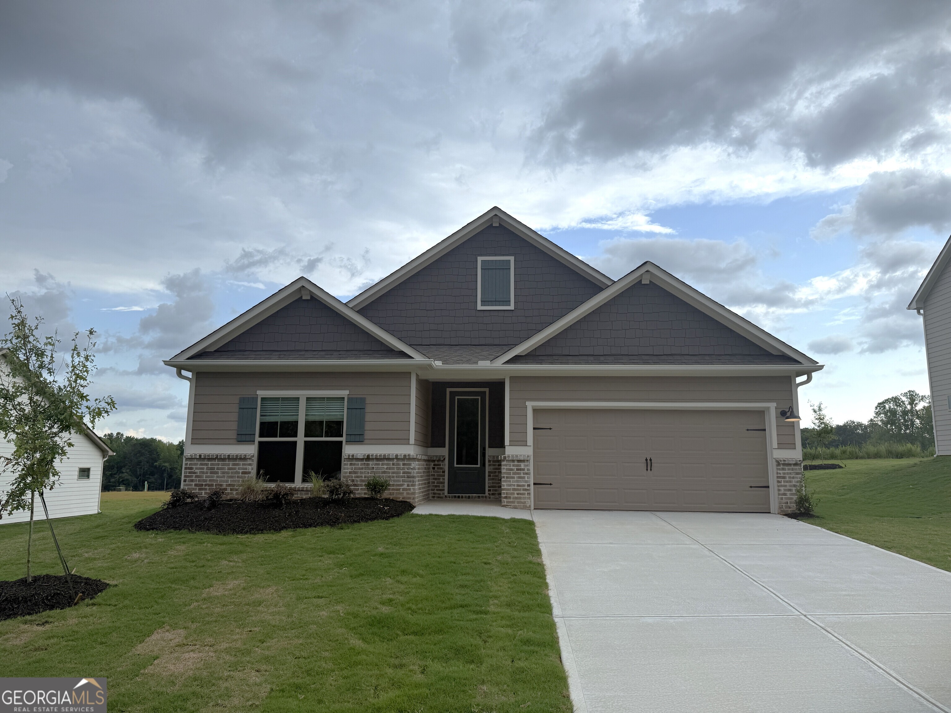 Experience comfortable single-story living at 534 Cantrell Drive with the thoughtfully designed Davenport plan by LGI Homes. This 3-bedroom, 2-bathroom home features a spacious great room and a cozy dining area that flow seamlessly into the well-equipped kitchen, complete with stainless-steel Whirlpool appliances, quartz countertops, and upper-wood cabinets-all included in the CompleteHome PlusTM package. Entertain with ease in the open living spaces, or enjoy meals in the inviting sunroom-style dining area. The generously sized primary suite easily accommodates a king-sized bed and offers dual walk-in closets along with a luxurious en-suite bathroom for your personal retreat. Two additional bedrooms provide versatile space for family, guests, or a home office. The laundry room doubles as a convenient mudroom, helping keep your home organized and tidy. Step outside to the covered back patio and take in the professionally landscaped front yard. Additional features include recessed lighting, a Wi-Fi-enabled garage door opener, and a two-car garage. Located on one of the community's higher elevations for scenic views and added privacy, 534 Cantrell Drive combines style, function, and value, making it a perfect place to call home. Color schemes vary by floorplan and elevation.